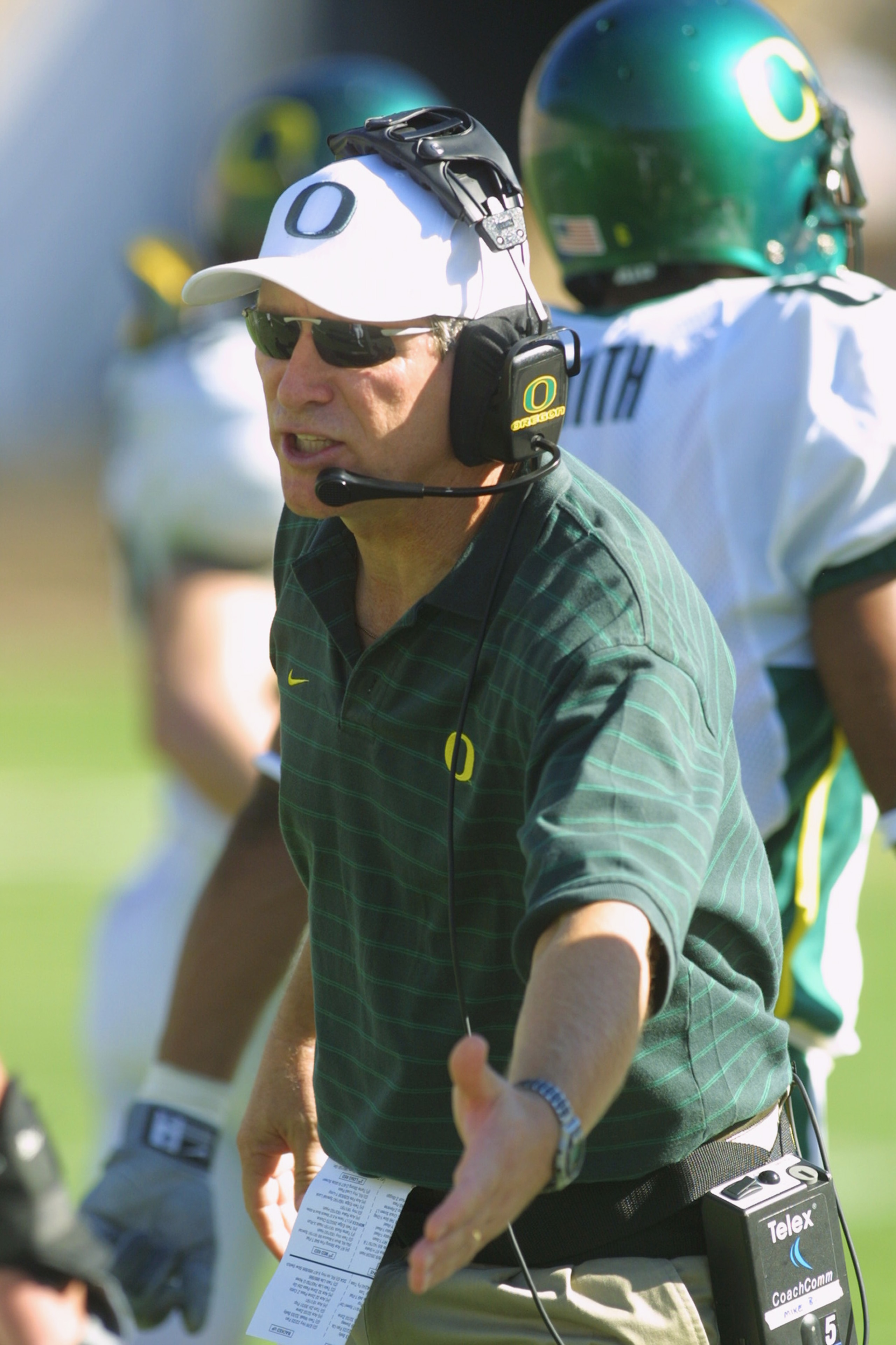 BERKELEY, CA - OCTOBER 13:  Head coach Mike Belotti of the Oregon Ducks congratulates his players during the Pac-10 Conference football game against the California Golden Bears on October 13, 2001 at Memorial Stadium in Berkeley, California. Oregon crushe