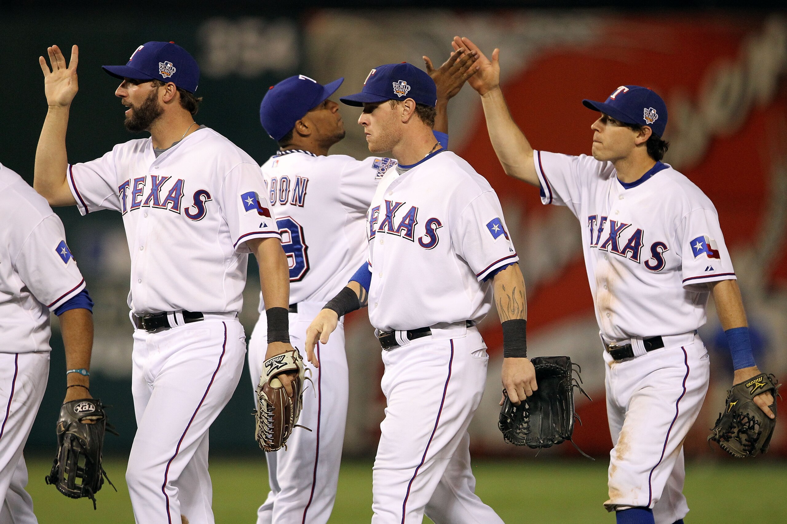 ARLINGTON, TX - OCTOBER 30:  (L-R) Jeff Francoeur #21, Julio Borbon #29, Josh Hamilton #32 and Ian Kinsler #5 of the Texas Rangers celebrate after the Rangers won 4-2 against the San Francisco Giants in Game Three of the 2010 MLB World Series at Rangers B