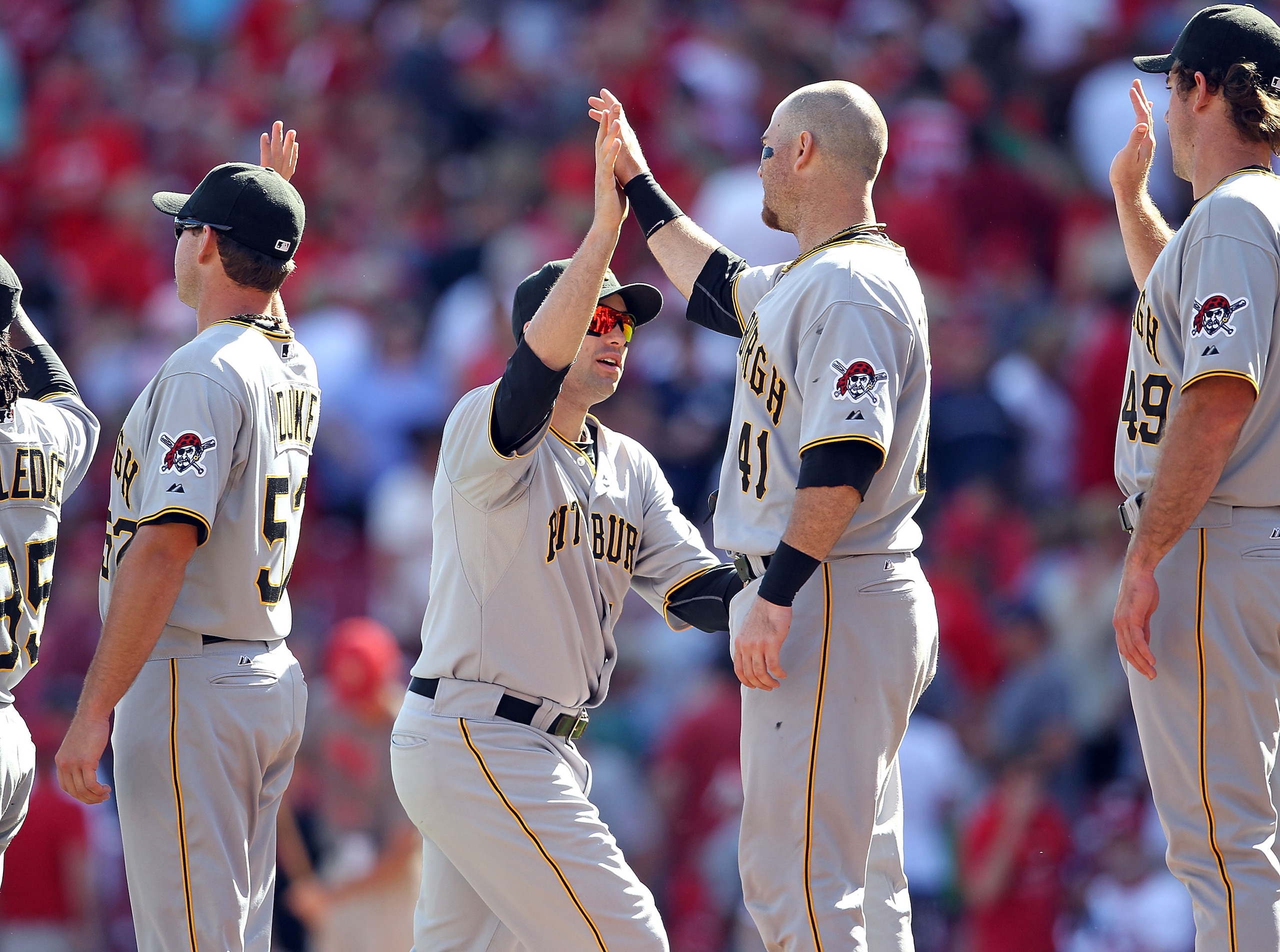 CINCINNATI - SEPTEMBER 12:  Neil Walker #18 of the Pittsburgh Pirates is congratulated by Ryan Doumit #41 after the Pirates beat the Cincinnati Reds 3-1 at Great American Ball Park on September 12, 2010 in Cincinnati, Ohio.  (Photo by Andy Lyons/Getty Ima