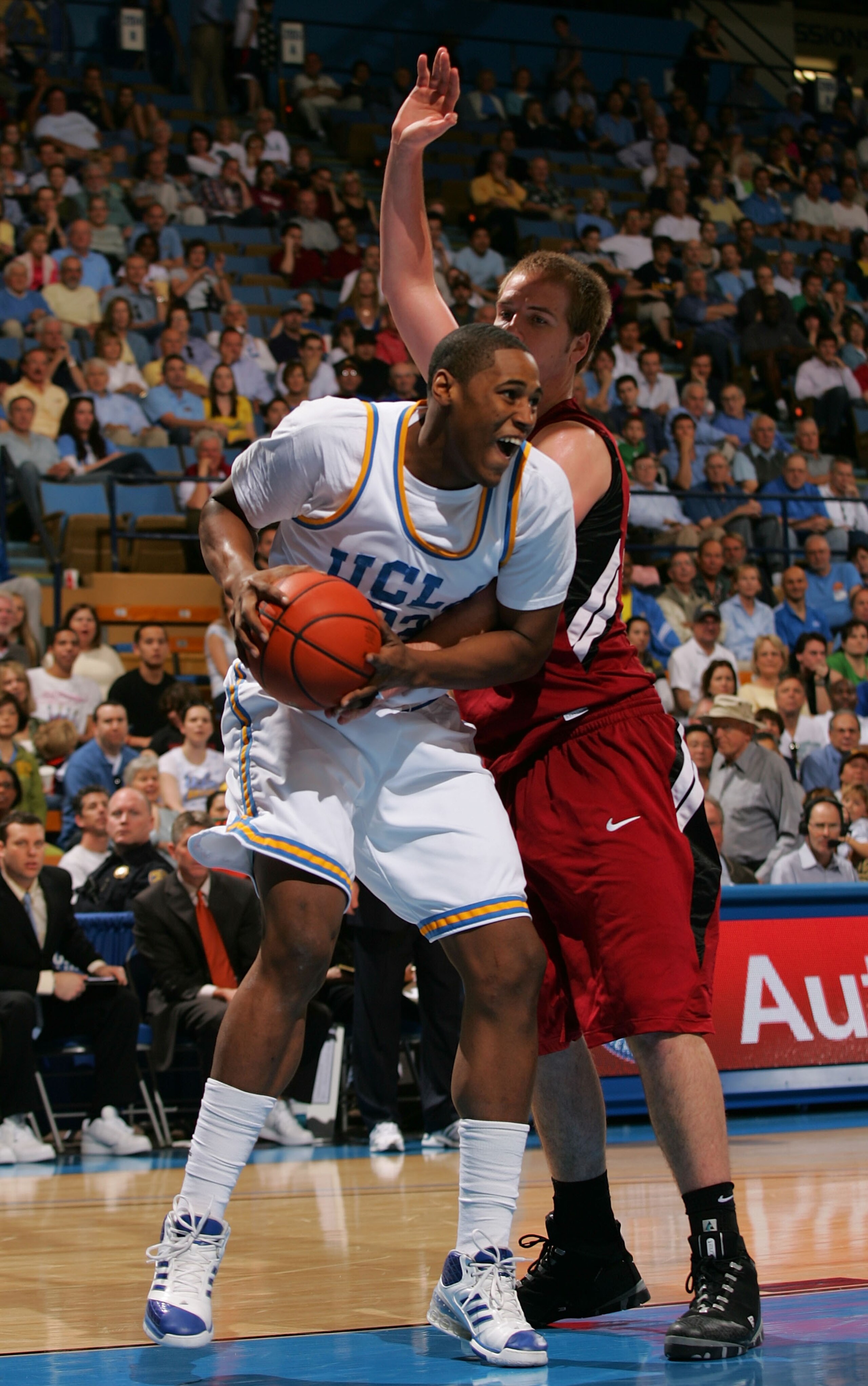 WESTWOOD, CA - JANUARY 31:  J'mison Morgan #22 of the UCLA Bruins posts up Will Paul #34 of Stanford Cardinal int he second half during their NCAA basketball game at Pauley Pavilion on January 31, 2009 in Westwood, California.  The Bruins defeated the Car