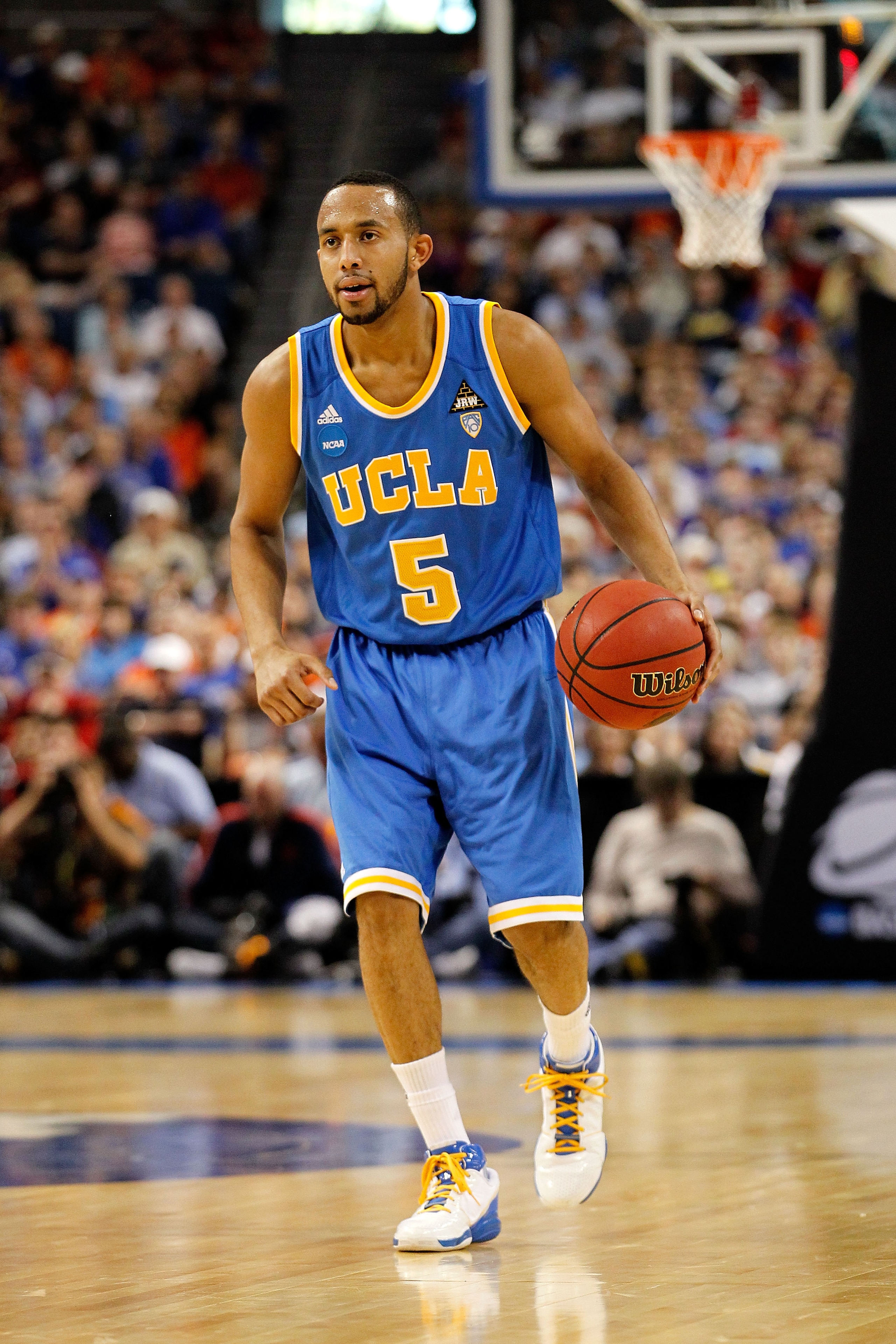 TAMPA, FL - MARCH 19:  Jerime Anderson #5 of the UCLA Bruins look to pass aagainst the Florida Gators during the third round of the 2011 NCAA men's basketball tournament at St. Pete Times Forum on March 19, 2011 in Tampa, Florida. Florida won 73-65.  (Pho