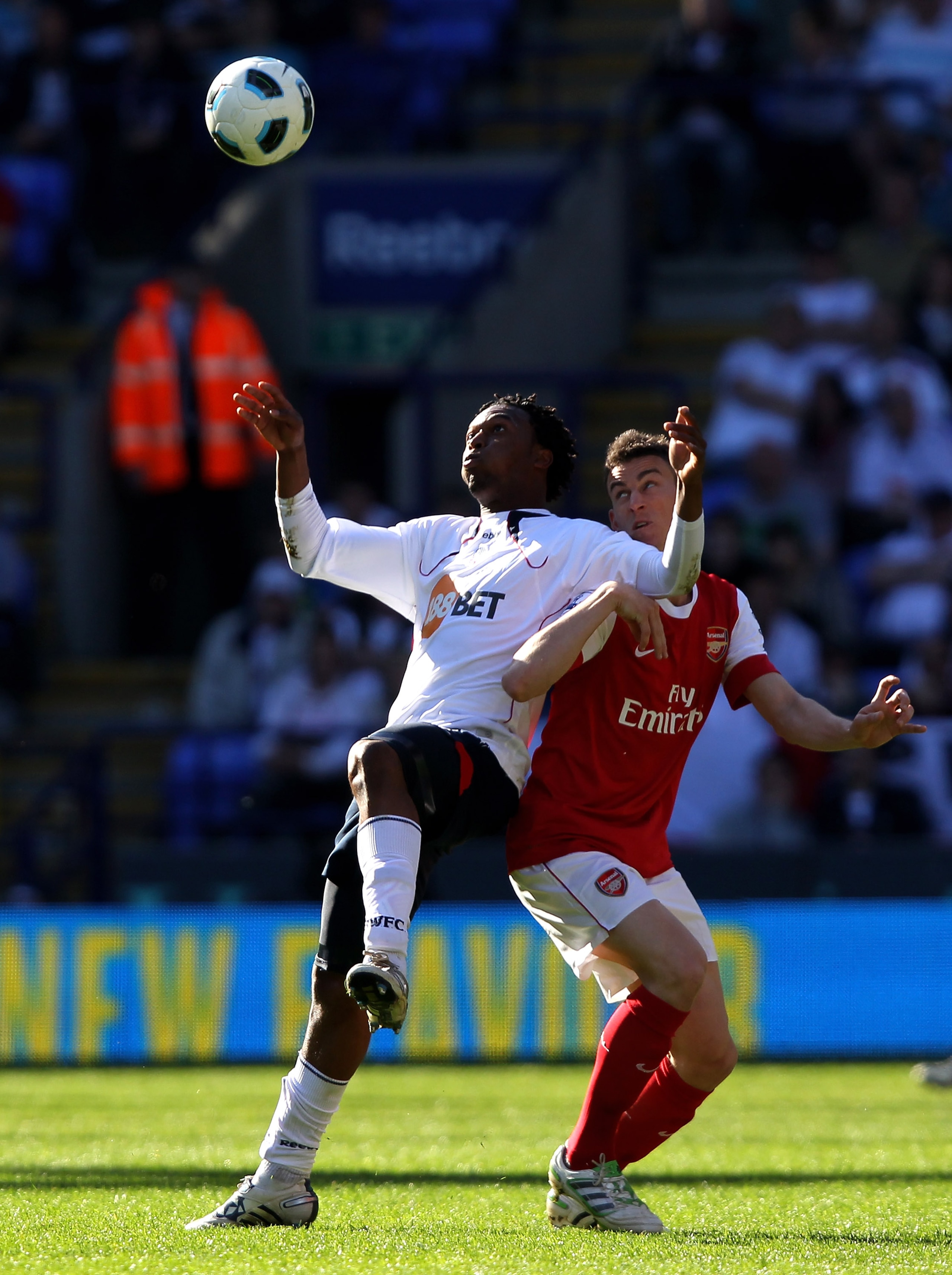 BOLTON, ENGLAND - APRIL 24:  Laurent Koscielny of Arsenal competes with Daniel Sturridge of Bolton Wanderers during the Barclays Premier League match between Bolton Wanderers and Arsenal at the Reebok Stadium on April 24, 2011 in Bolton, England.  (Photo