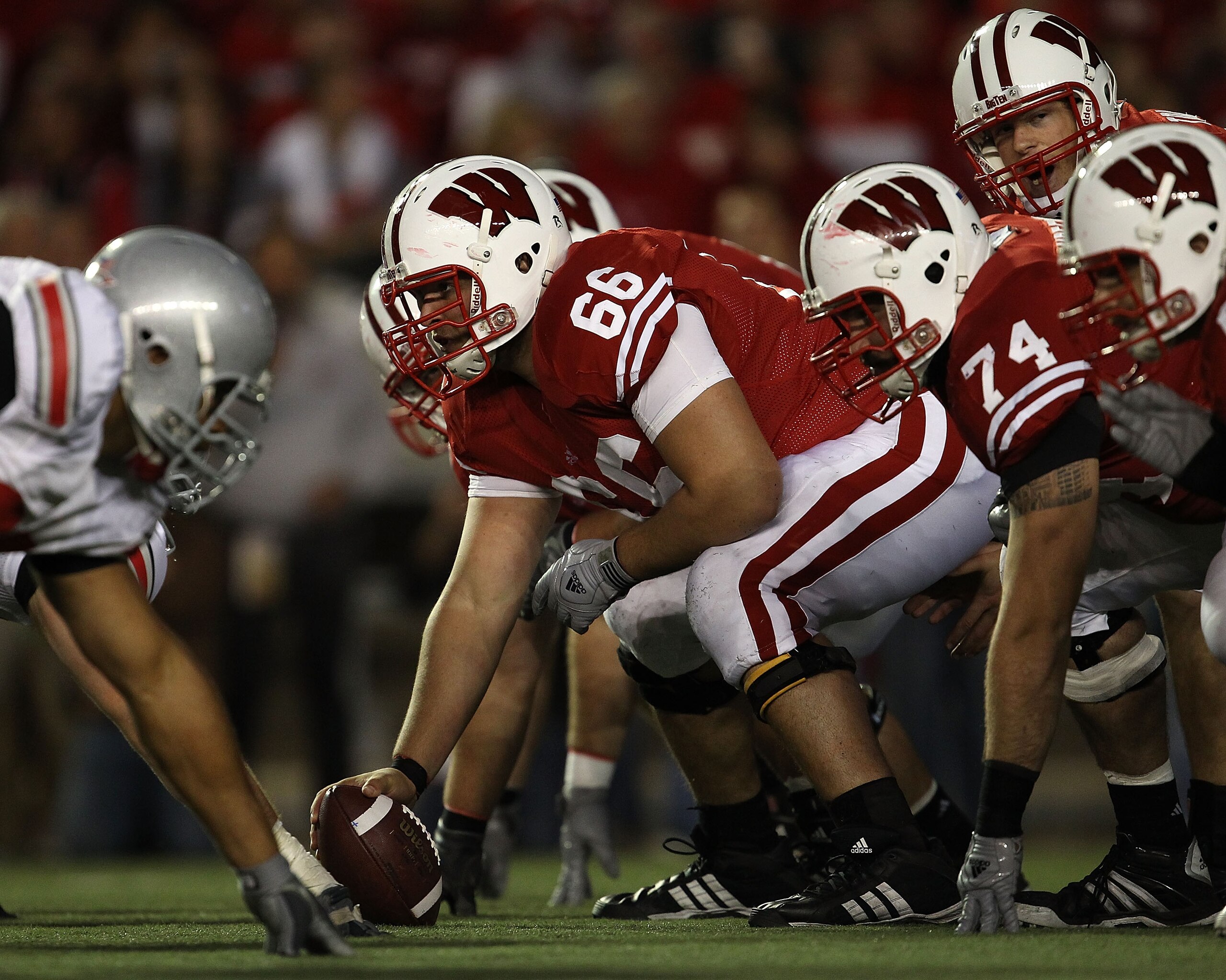 MADISON, WI - OCTOBER 16: Peter Konz #66 of the Wisconsin Badgers prepares to snap the ball to Scott Tolzien #16 against the Ohio State Buckeyes at Camp Randall Stadium on October 16, 2010 in Madison, Wisconsin. Wisconsin defeated Ohio State 31-18. (Phot MADISON, WI - OCTOBER 16: Peter Konz #66 of the Wisconsin Badgers prepares to snap the ball to Scott Tolzien #16 against the Ohio State Buckeyes at Camp Randall Stadium on October 16, 2010 in Madison, Wisconsin. Wisconsin defeated Ohio State 31-18. (Phot