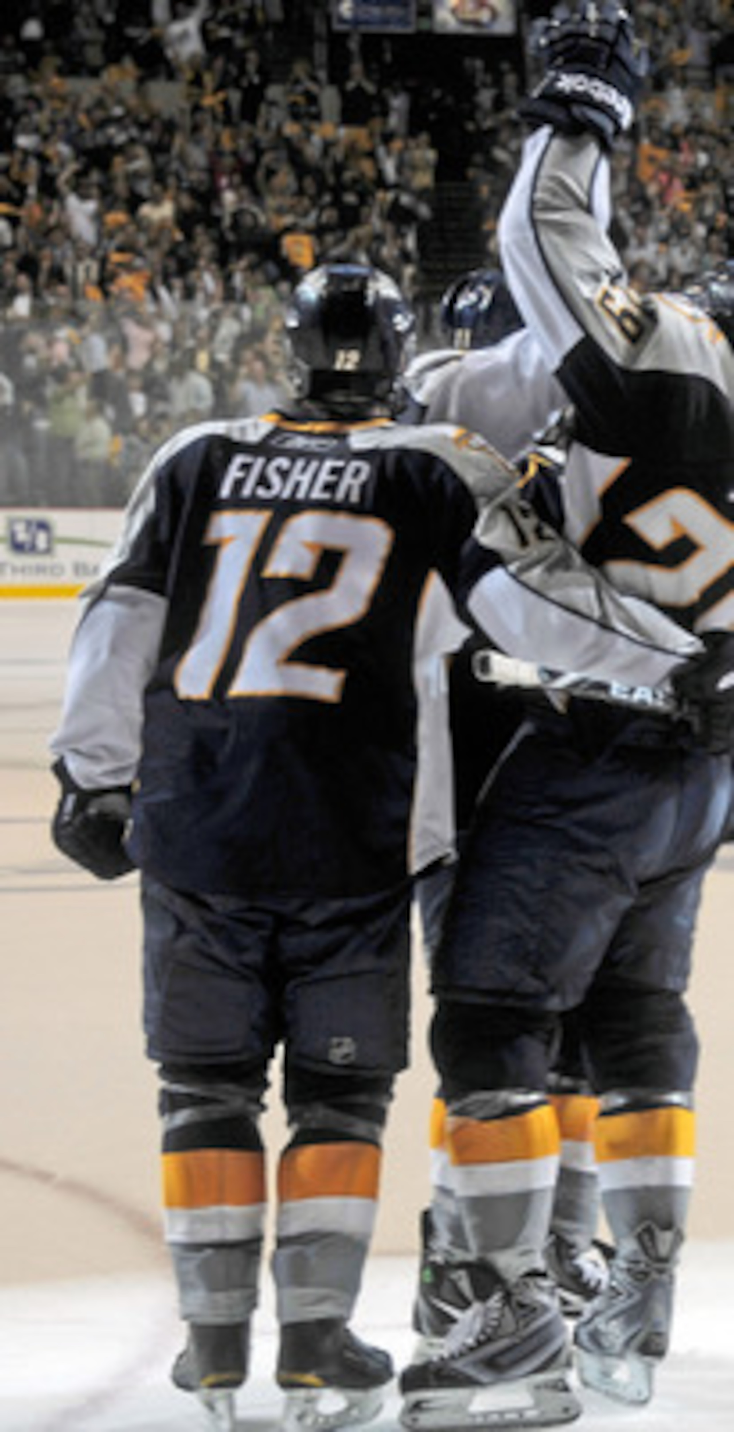 NASHVILLE, TN - APRIL 24:   Mike Fisher #12 and Joel Ward #29 of the Nashville Predators celebrate an open net goal, sealing a victry over the Anaheim Ducks in Game Six of the Western Conference Quarterfinals during the 2011 NHL Stanley Cup Playoffs at Br