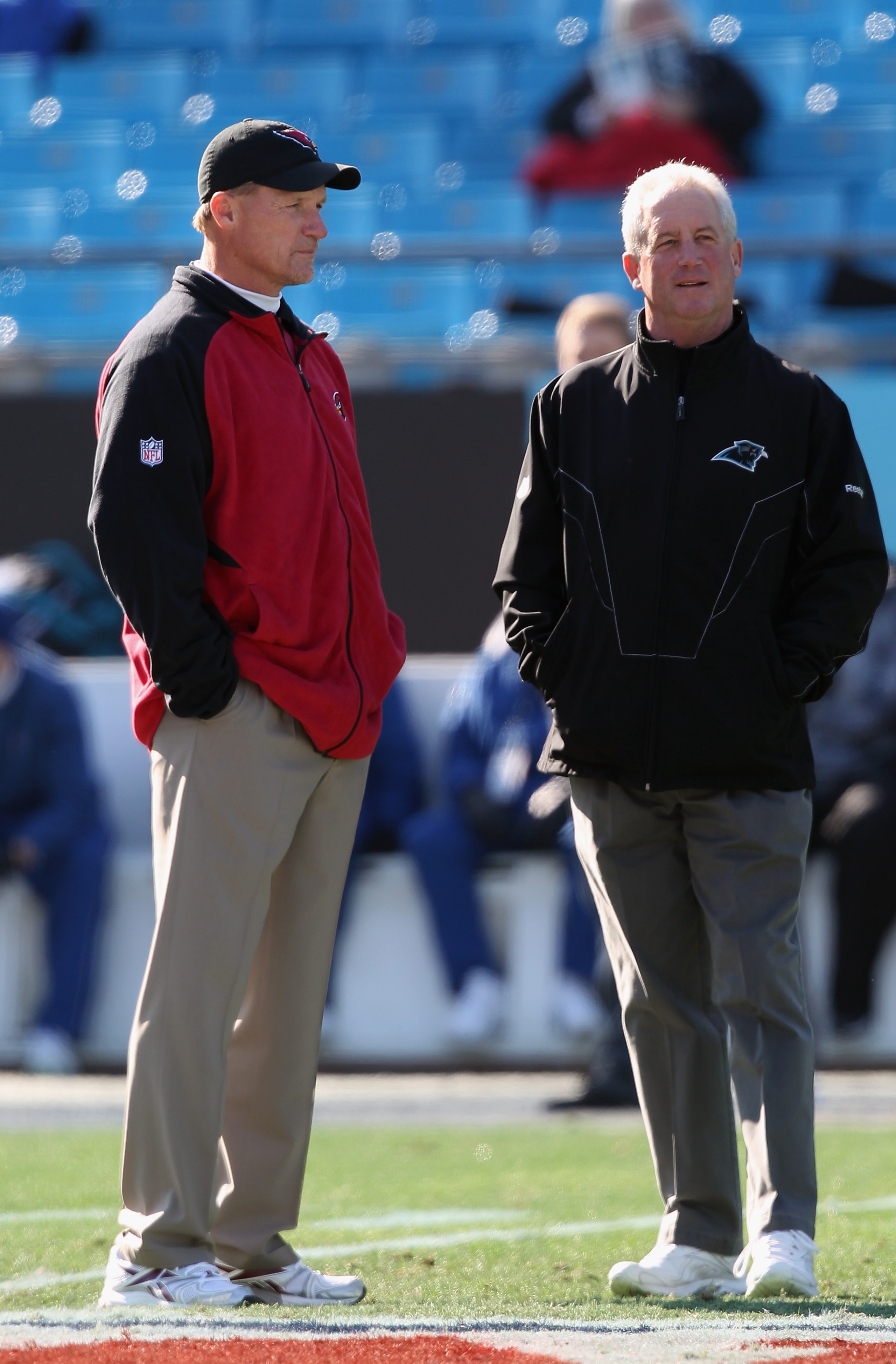 CHARLOTTE, NC - DECEMBER 19: Head coach Ken Whisenhunt of the Arizona Cardinals talks with head coach John Fox of the Carolina Panthers before the start of their game at Bank of America Stadium on December 19, 2010 in Charlotte, North Carolina. (Photo b CHARLOTTE, NC - DECEMBER 19: Head coach Ken Whisenhunt of the Arizona Cardinals talks with head coach John Fox of the Carolina Panthers before the start of their game at Bank of America Stadium on December 19, 2010 in Charlotte, North Carolina. (Photo b
