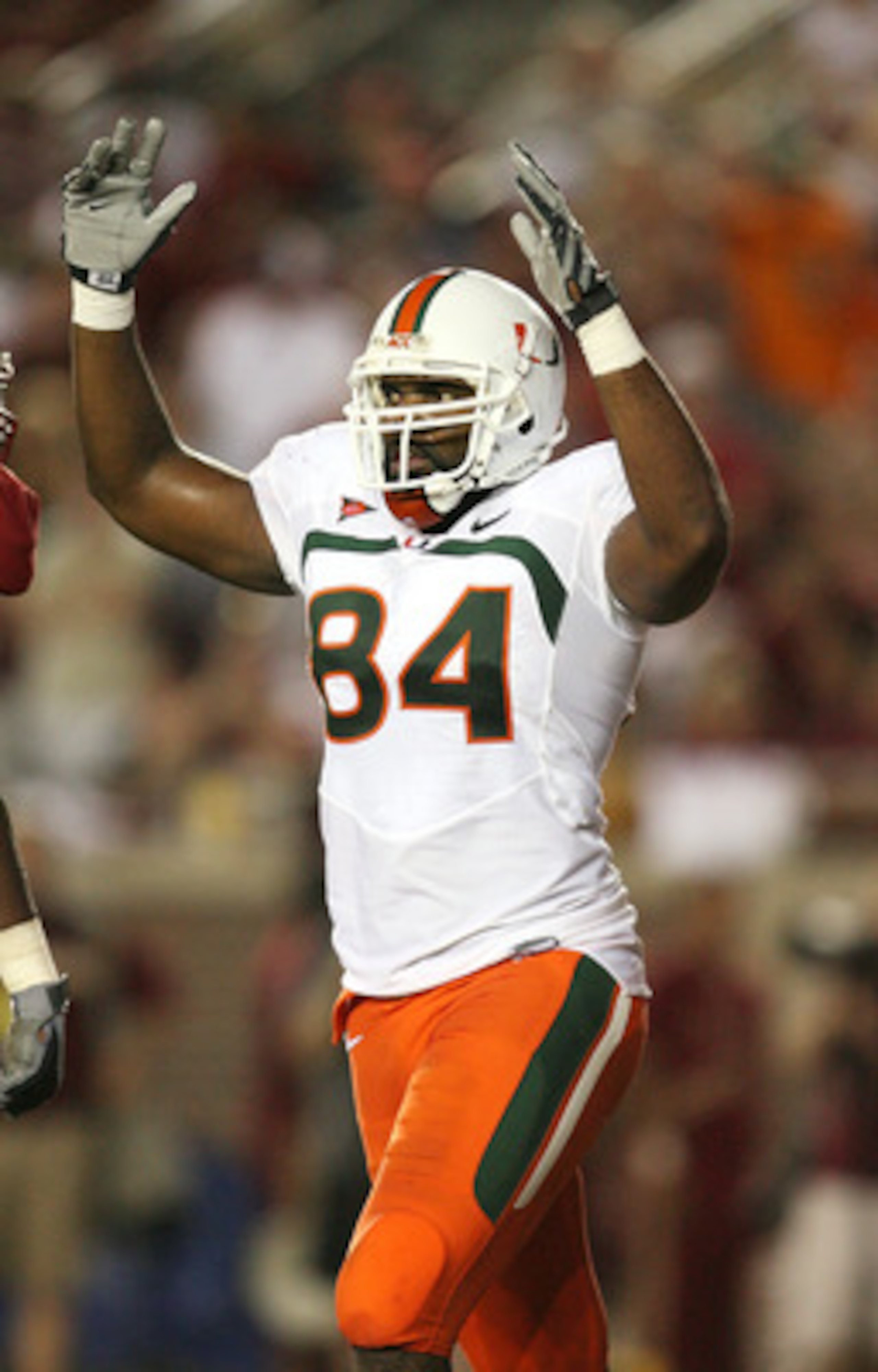 TALLAHASSEE, FL - SEPTEMBER 07:  Tight end Richard Gordon #84 of the Miami Hurricanes celebrates after a fourth quarter touchdown by running back Graig Cooper #32 against the Florida State Seminoles at Doak Campbell Stadium on September 7, 2009 in Tallaha