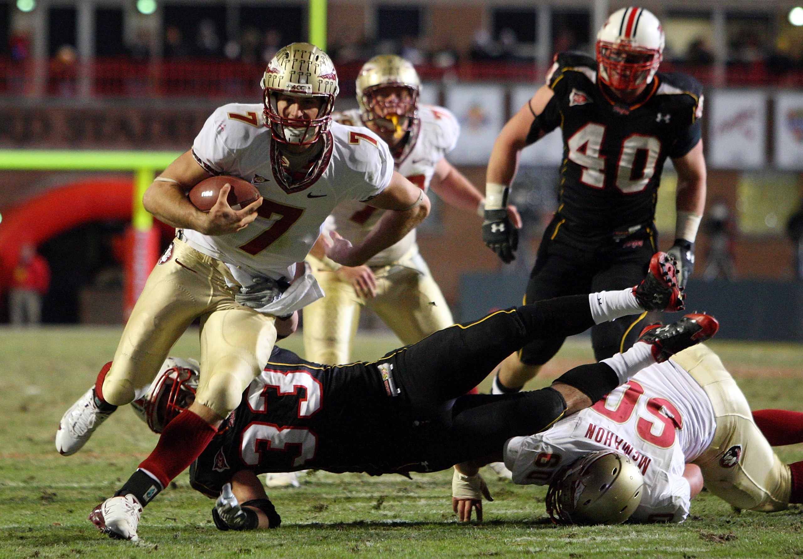 COLLEGE PARK, MD - NOVEMBER 22:  Christian Ponder #7 of the Florida State Seminoles runs the ball past Alex Wujciak #33 of the Maryland Terrapins on November 22, 2008 at Byrd Stadium in College Park, Maryland.  (Photo by Jim McIsaac/Getty Images)