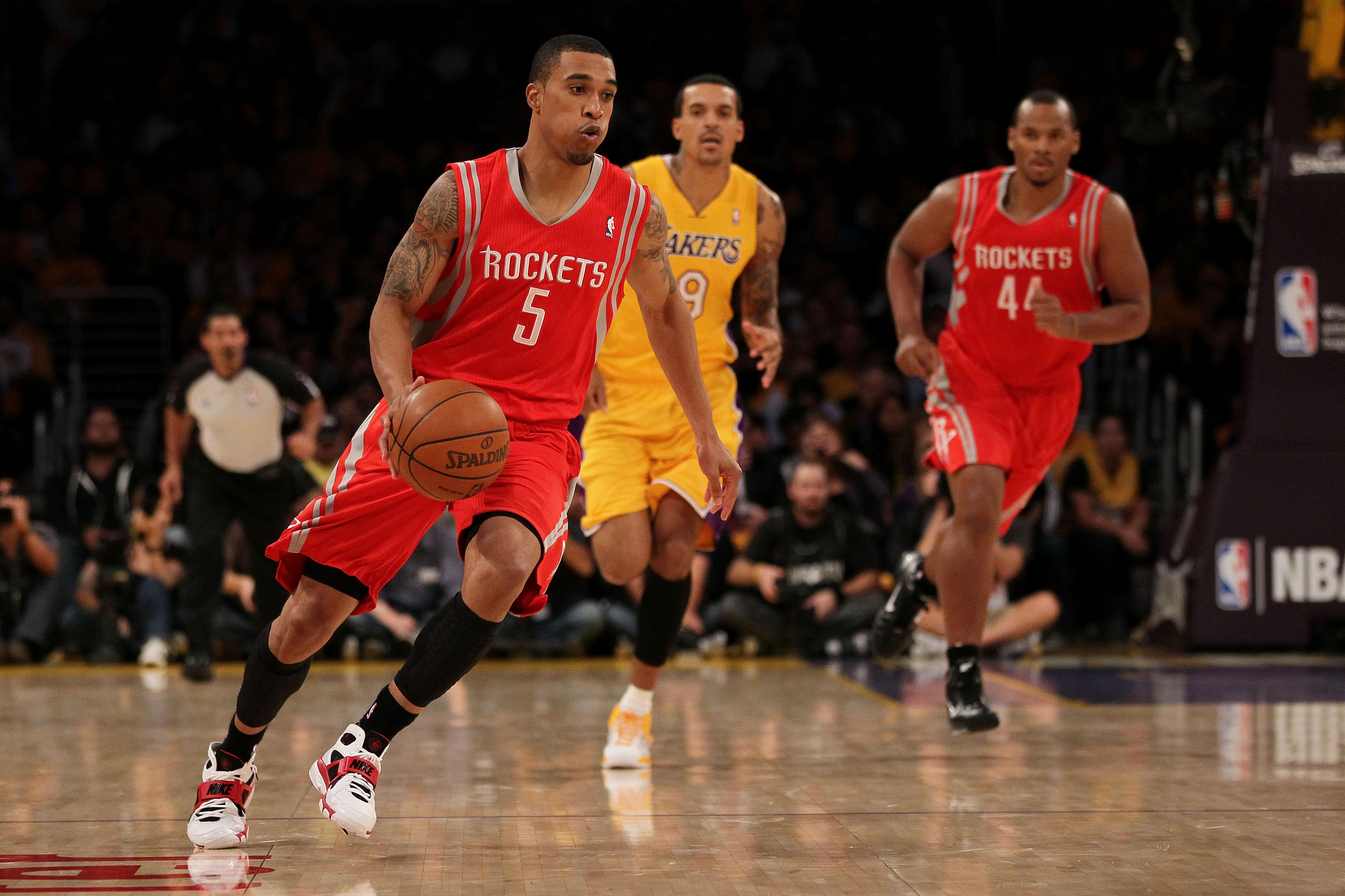 Houston Rockets' Tracy McGrady, right, tries to maintain control