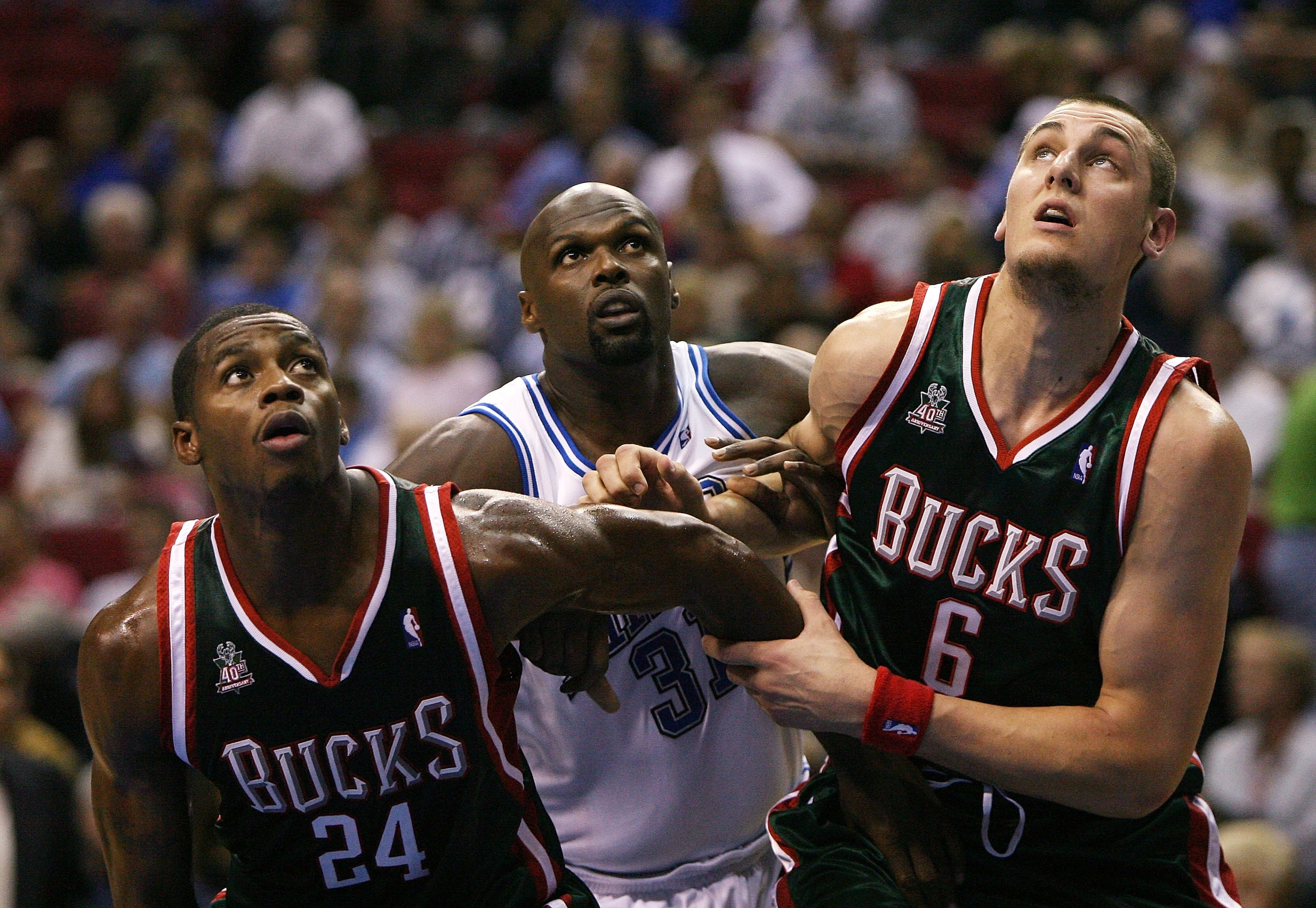 ORLANDO, FL - OCTOBER 31:  Desmond Mason #24 and Andrew Bogut #6 of the Milwaukee Bucks battle for position with Adonal Foyle #31 of the Orlando Magic at Amway Arena on October 31,  2007 in Orlando, Florida.  NOTE TO USER: User expressly acknowledges and