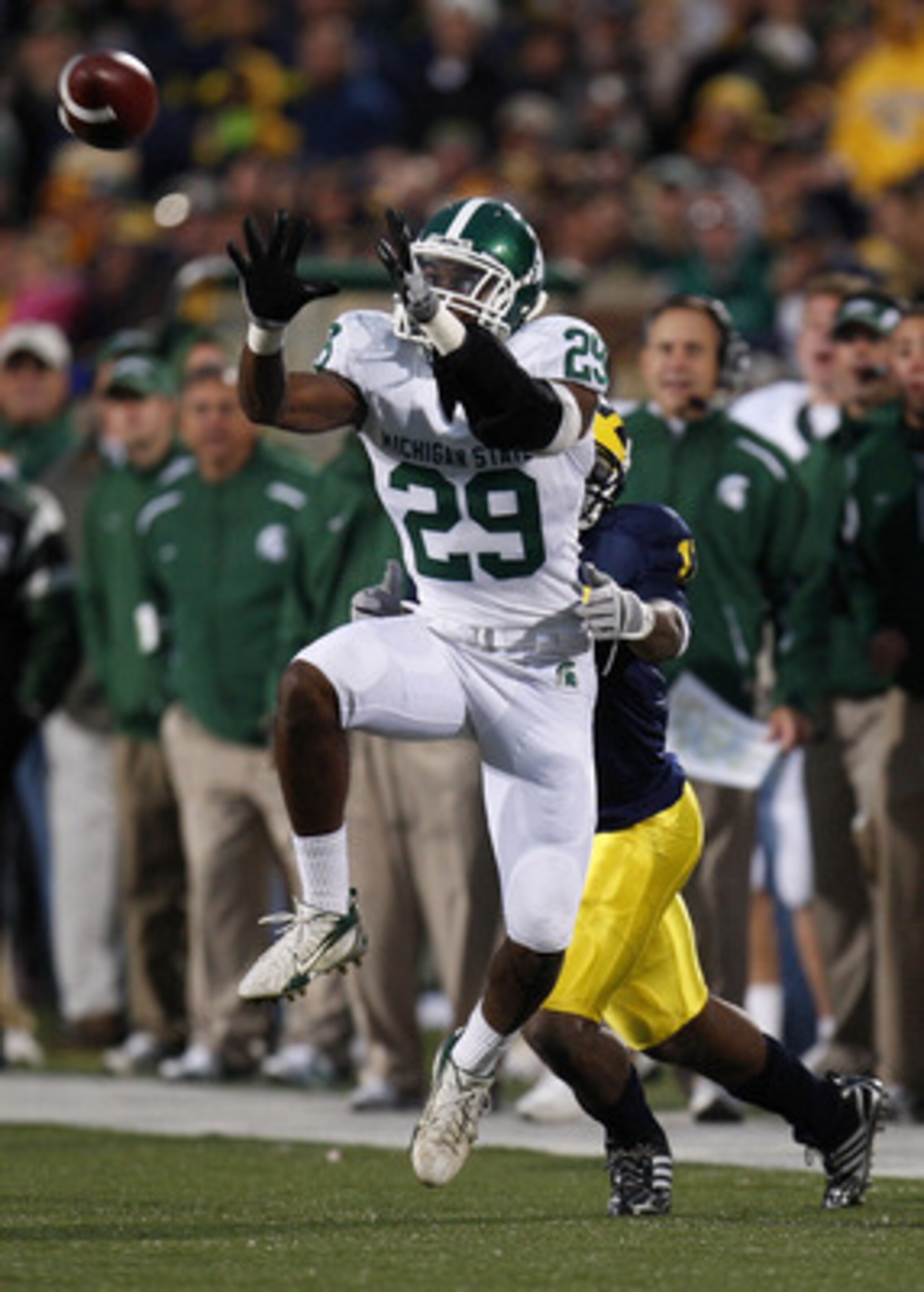 ANN ARBOR, MI - OCTOBER 25: Chris L. Rucker of the Michigan State Spartans intercepts a fourth quarter pass in front of Toney Clemons #17 of the Michigan Wolverines on October 25, 2008 at Michigan Stadium in Ann Arbor, Michigan.  Michigan State won the ga