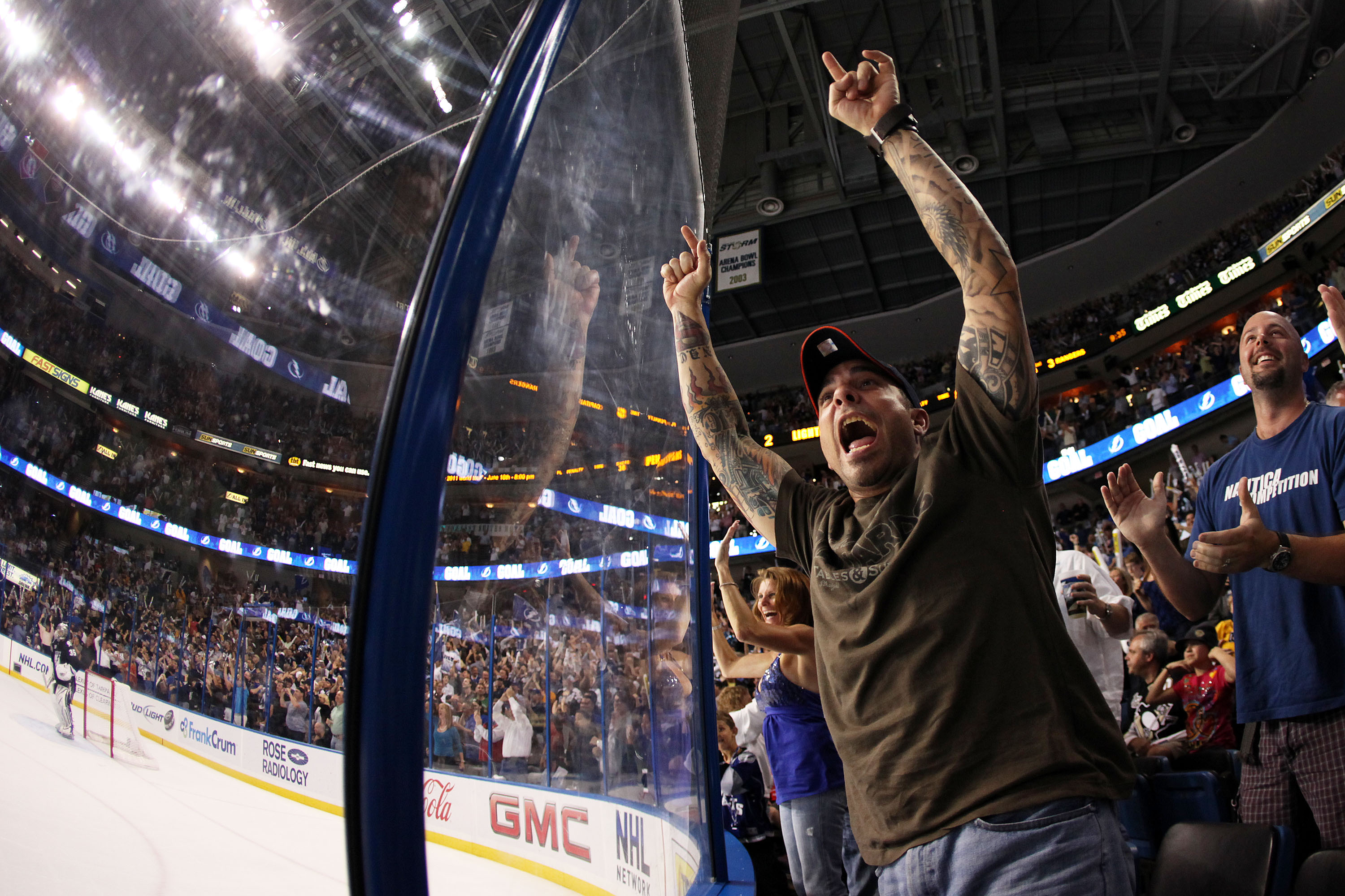 The crowd waves towels and cheers as lasers and spotlights swirl over the  ice at Consol Energy Center before Game 5 of the NHL hockey Stanley Cup  Eastern Conference finals between the