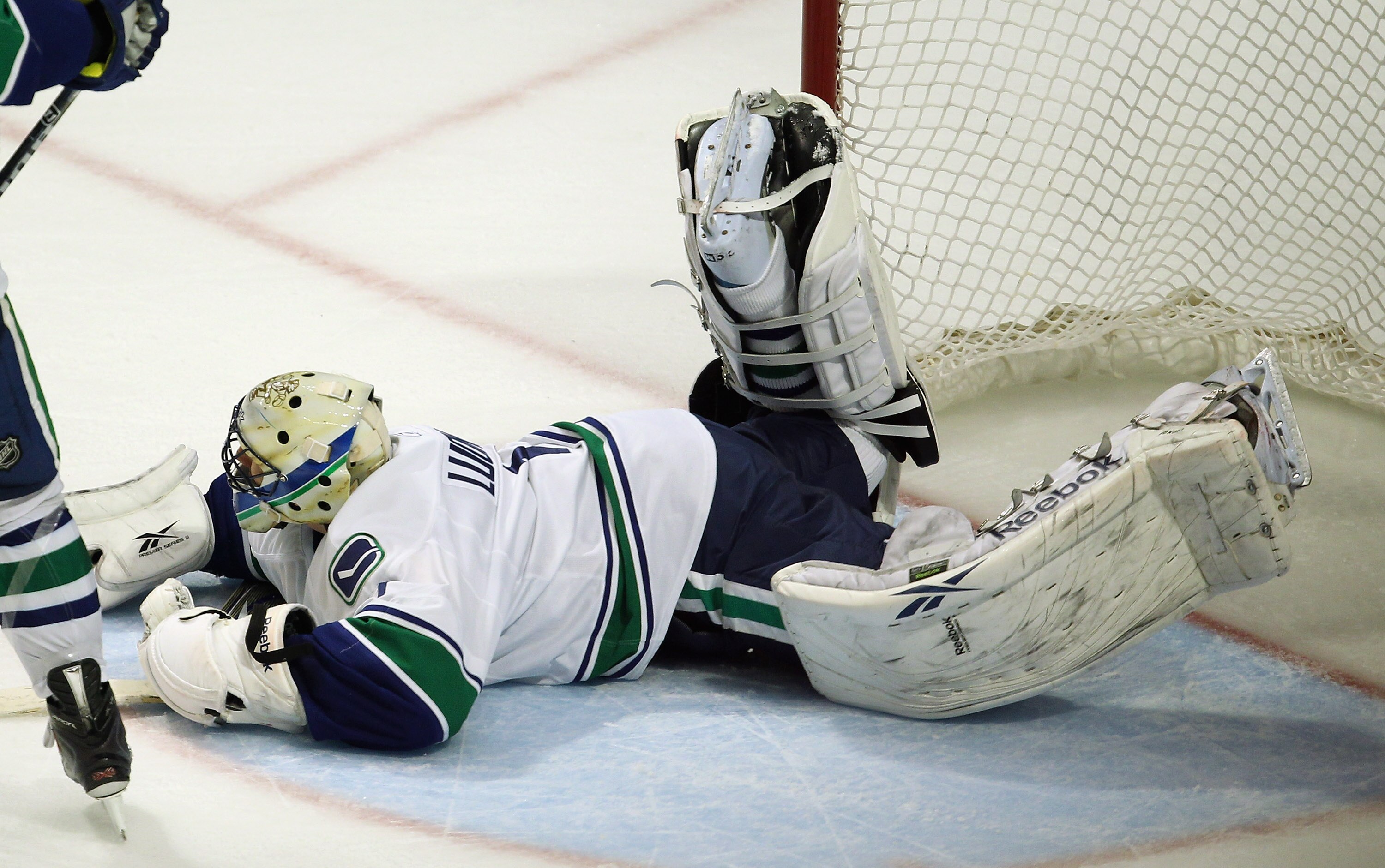 CHICAGO, IL - APRIL 24: Roberto Luongo #1 of the Vancouver Canucks lays on the ice after giving up the winning goal against the Chicago Blackhawks in Game Six of the Western Conference Quarterfinals during the 2011 NHL Stanley Cup Playoffs at the United C CHICAGO, IL - APRIL 24: Roberto Luongo #1 of the Vancouver Canucks lays on the ice after giving up the winning goal against the Chicago Blackhawks in Game Six of the Western Conference Quarterfinals during the 2011 NHL Stanley Cup Playoffs at the United C