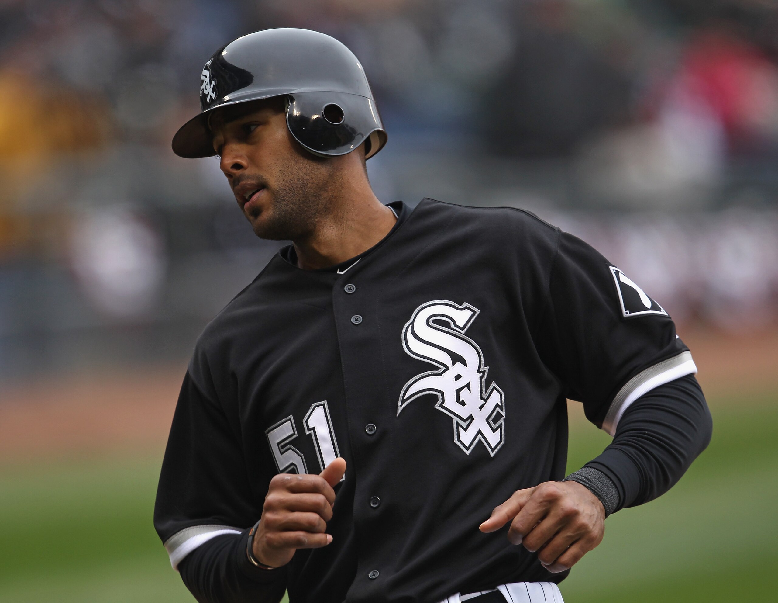 CHICAGO, IL - APRIL 07: Alex Rios #51 of the Chicago White Sox scores a run against the Tampa Bay Rays during the home opener at U.S. Cellular Field on April 7, 2011 in Chicago, Illinois. The White Sox defeated the Rays 5-1. (Photo by Jonathan Daniel/Gett
