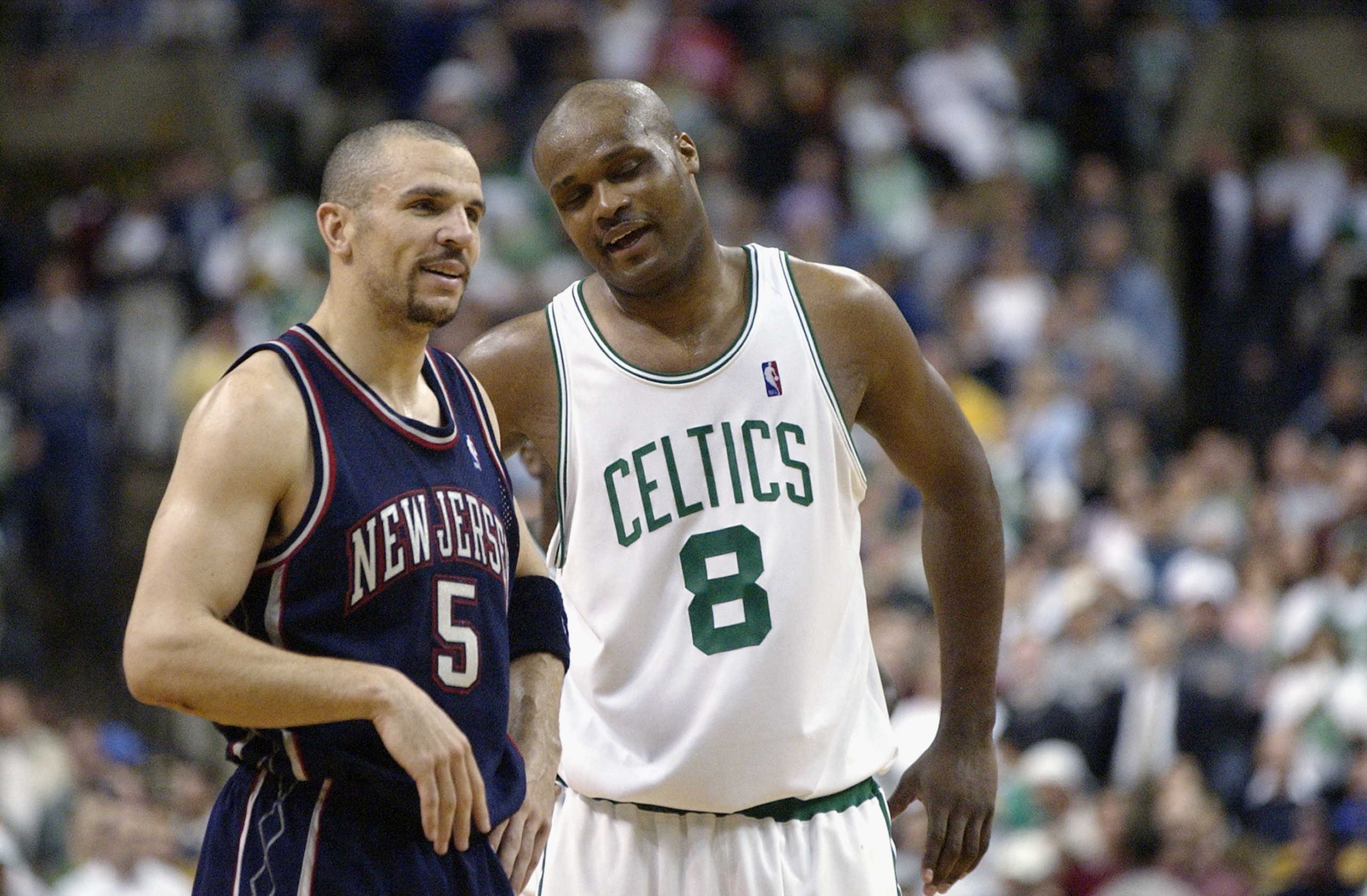 BOSTON - MAY 12:  Jason Kidd #5 of the New Jersey Nets talks to Antoine Walker #8 of the Boston Celtics in Game four of Eastern Conference Semifinals during 2003 NBA Playoffs at the Fleet Center on May 12, 2003 in Boston, Massachusetts.  The Nets won in d