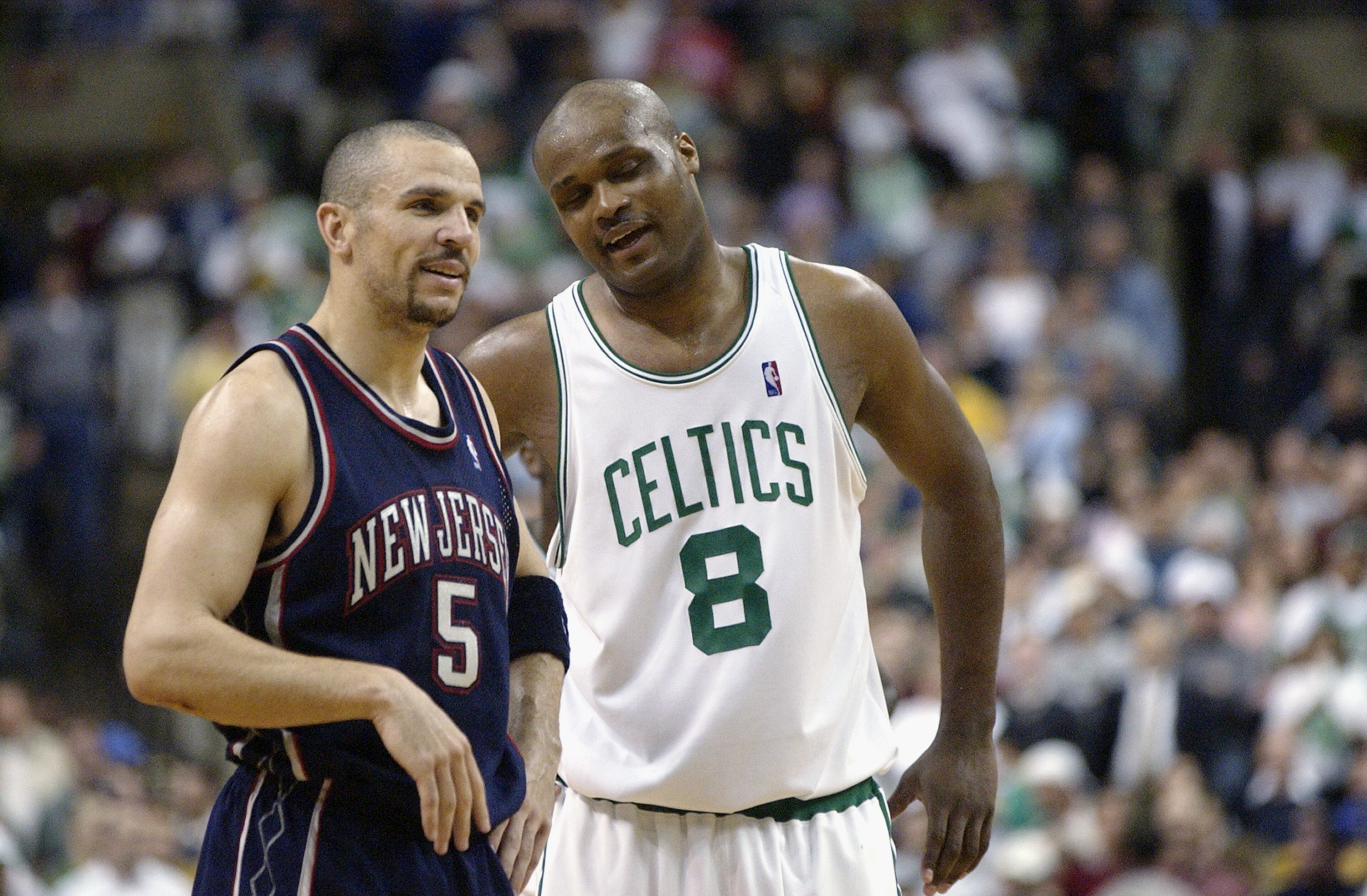 BOSTON - MAY 12:  Jason Kidd #5 of the New Jersey Nets talks to Antoine Walker #8 of the Boston Celtics in Game four of Eastern Conference Semifinals during 2003 NBA Playoffs at the Fleet Center on May 12, 2003 in Boston, Massachusetts.  The Nets won in d