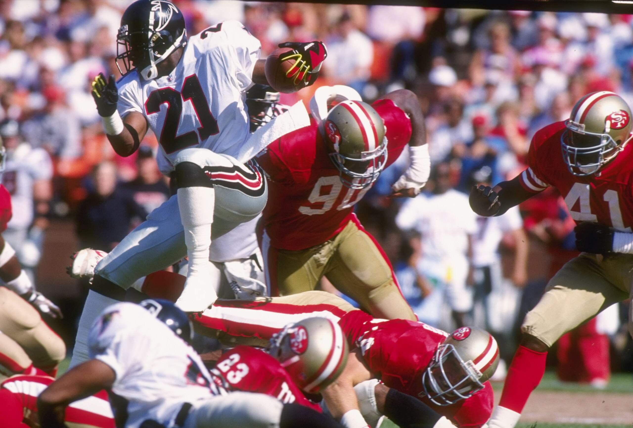 13 Oct 1991:  Defensive back Deion Sanders of the Atlanta Falcons runs with the ball during a game against the San Francisco 49ers at Candlestick Park in San Francisco, California.  The Falcons won the game 39-34. Mandatory Credit: Otto Greule  /Allsport
