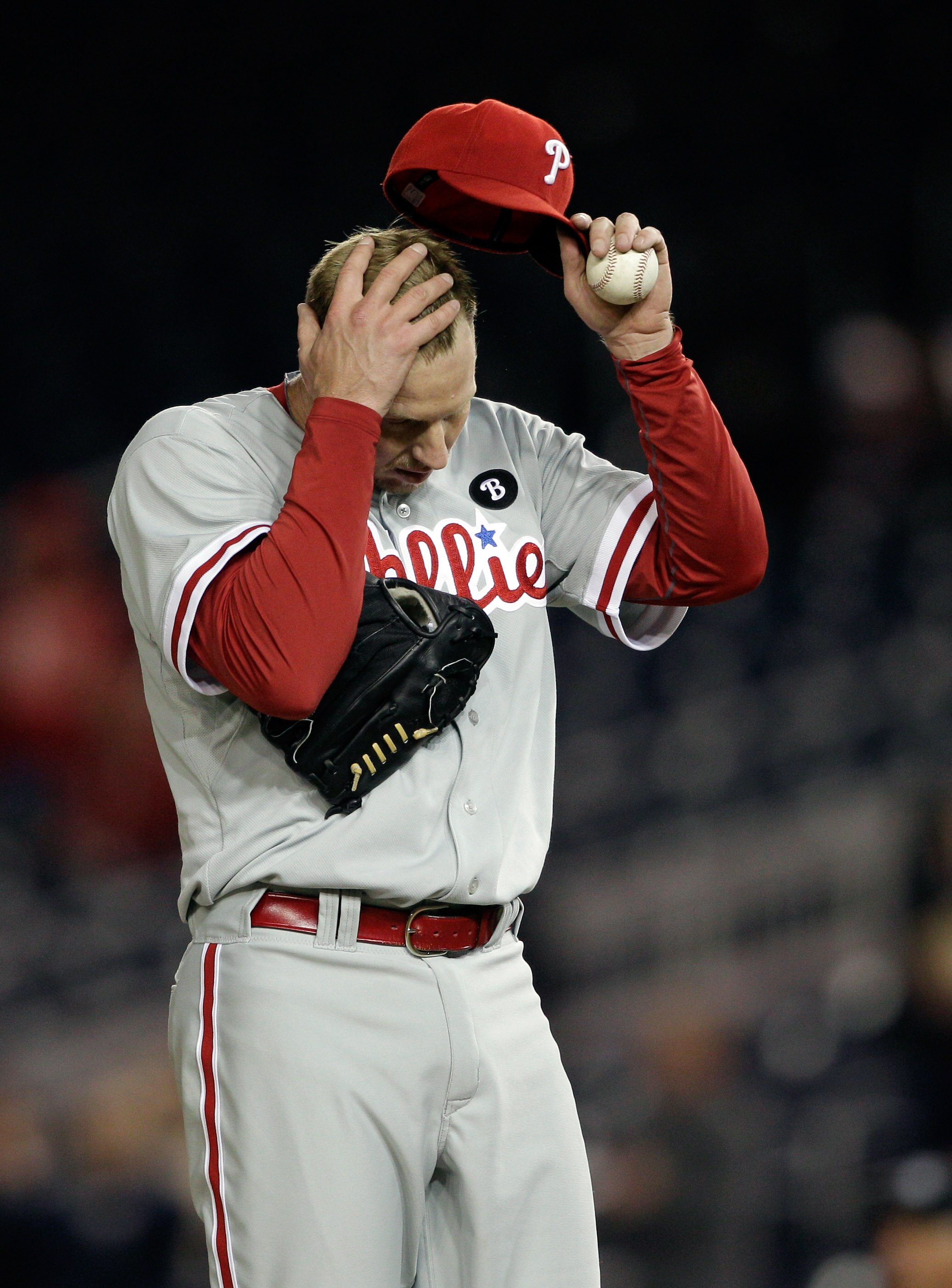 WASHINGTON, DC - APRIL 13:  Roy Halladay #34 of the Philadelphia Phillies adjust his cap after giving up a run to the Washington Nationals during the ninth inning at Nationals Park on April 13, 2011 in Washington, DC.  (Photo by Rob Carr/Getty Images)