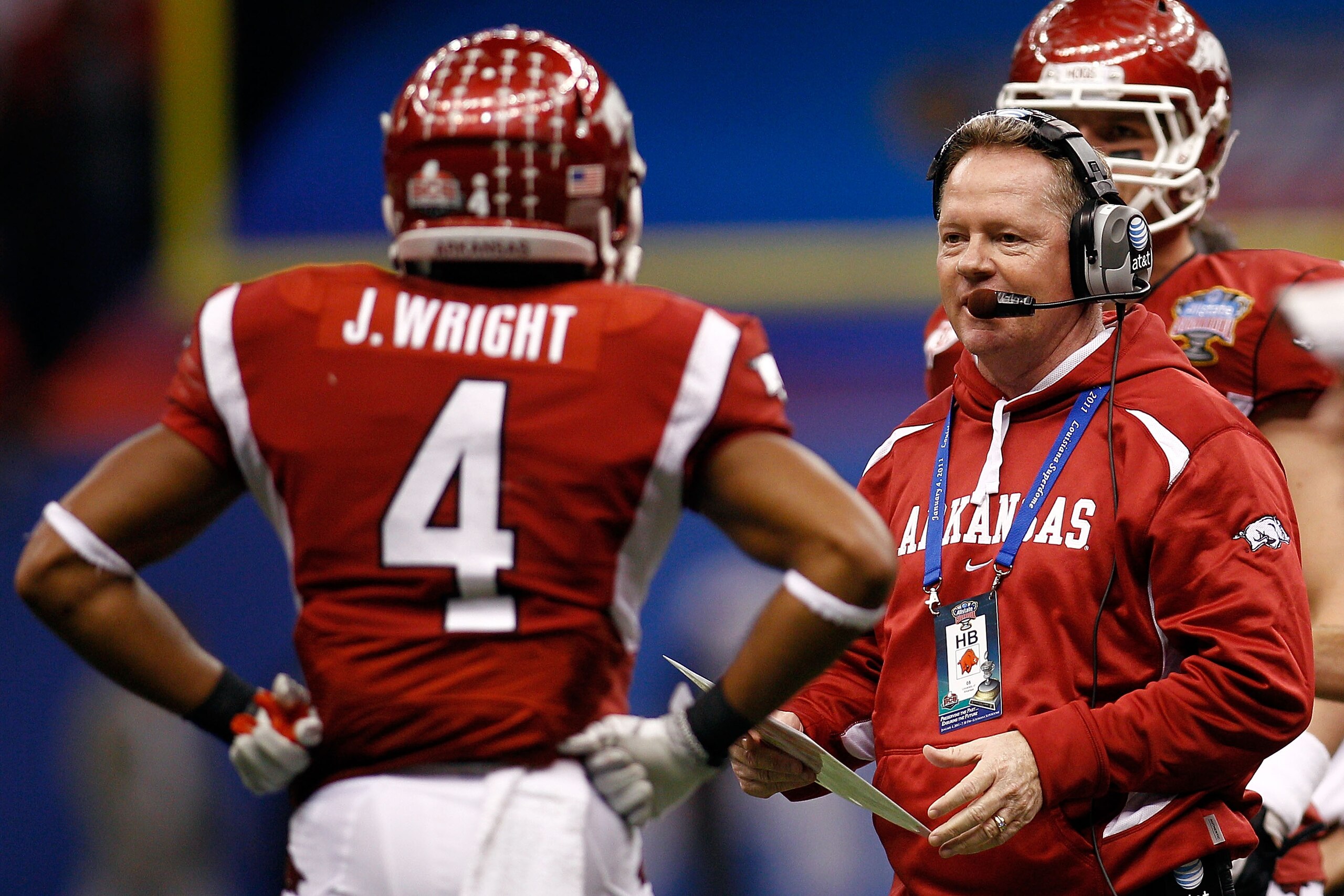 NEW ORLEANS, LA - JANUARY 04:  Head coach Bobby Petrino of the Arkansas Razorbacks looks over at Jarius Wright #4 against the Ohio State Buckeyes during the Allstate Sugar Bowl at the Louisiana Superdome on January 4, 2011 in New Orleans, Louisiana.  (Pho