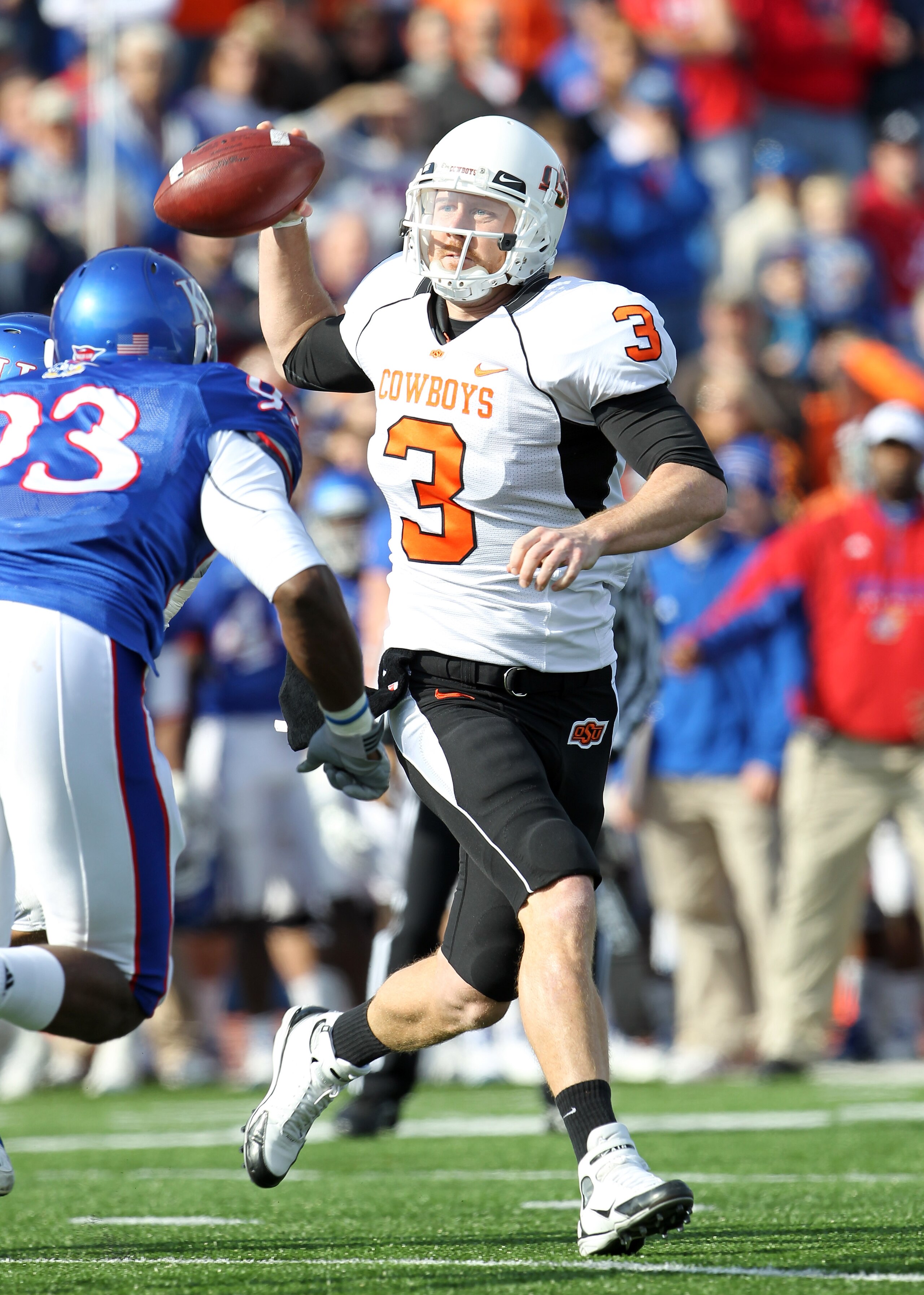 LAWRENCE, KS - NOVEMBER 20:  Quarterback Brandon Weeden #3 of the Oklahoma State Cowboys passes during the game against  the Kansas Jayhawks on November 20, 2010 at Memorial Stadium in Lawrence, Kansas.  (Photo by Jamie Squire/Getty Images)