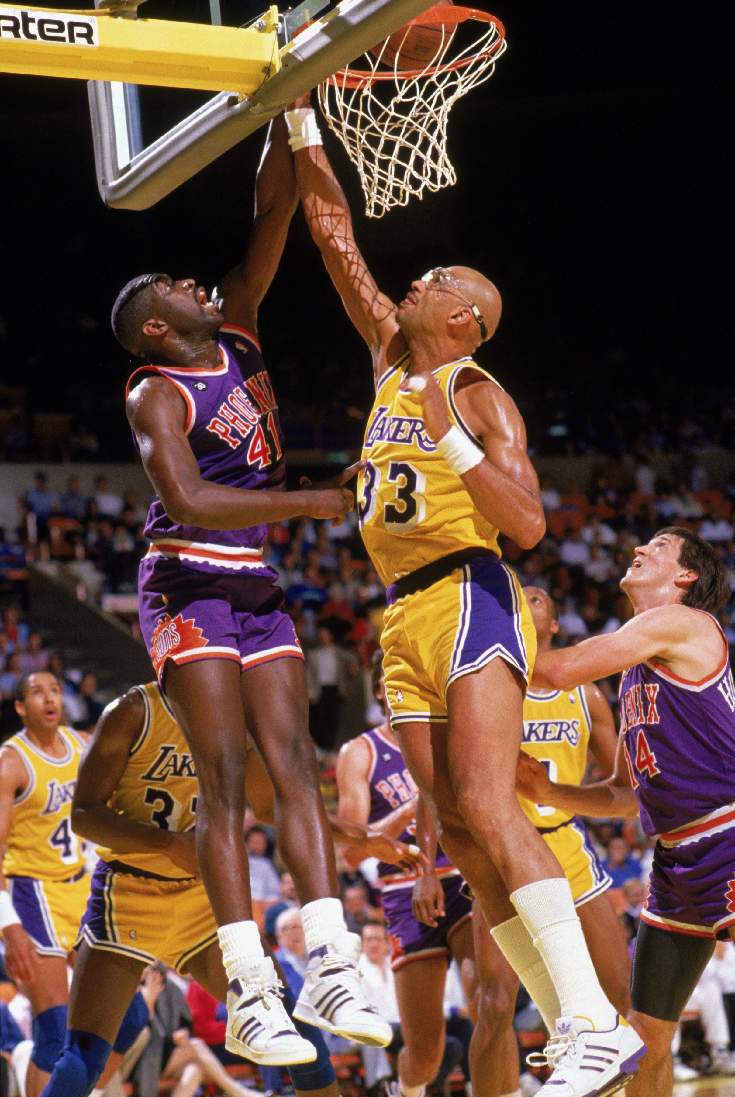 INGLEWOOD, CA - 1988:  Mark West #41 of the Phoenix Suns goes up against Kareem Abdul-Jabbar #33 of the Los Angeles Lakers during the game at the Great Western Forum in Inglewood, California. (Photo by Mike Powell/Getty Images)