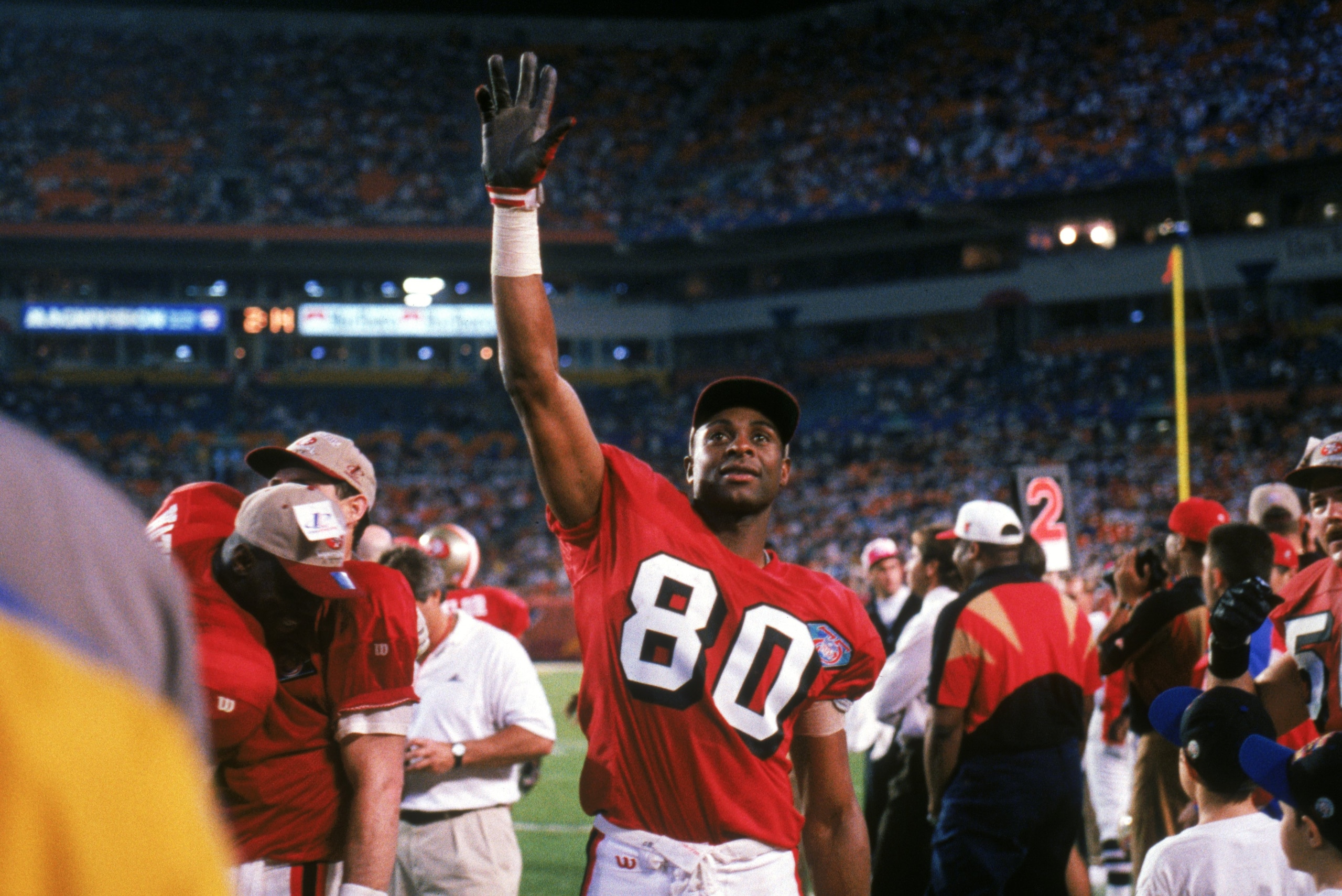 MIAMI - JANUARY 29:  Wide receiver Jerry Rice #80 of the San Francisco 49ers waves to the crowd during Super Bowl XXIX against the San Diego Chargers at Joe Robbie Stadium on January 29, 1995 in Miami, Florida.  The 49ers won 49-26. (Photo by George Rose/