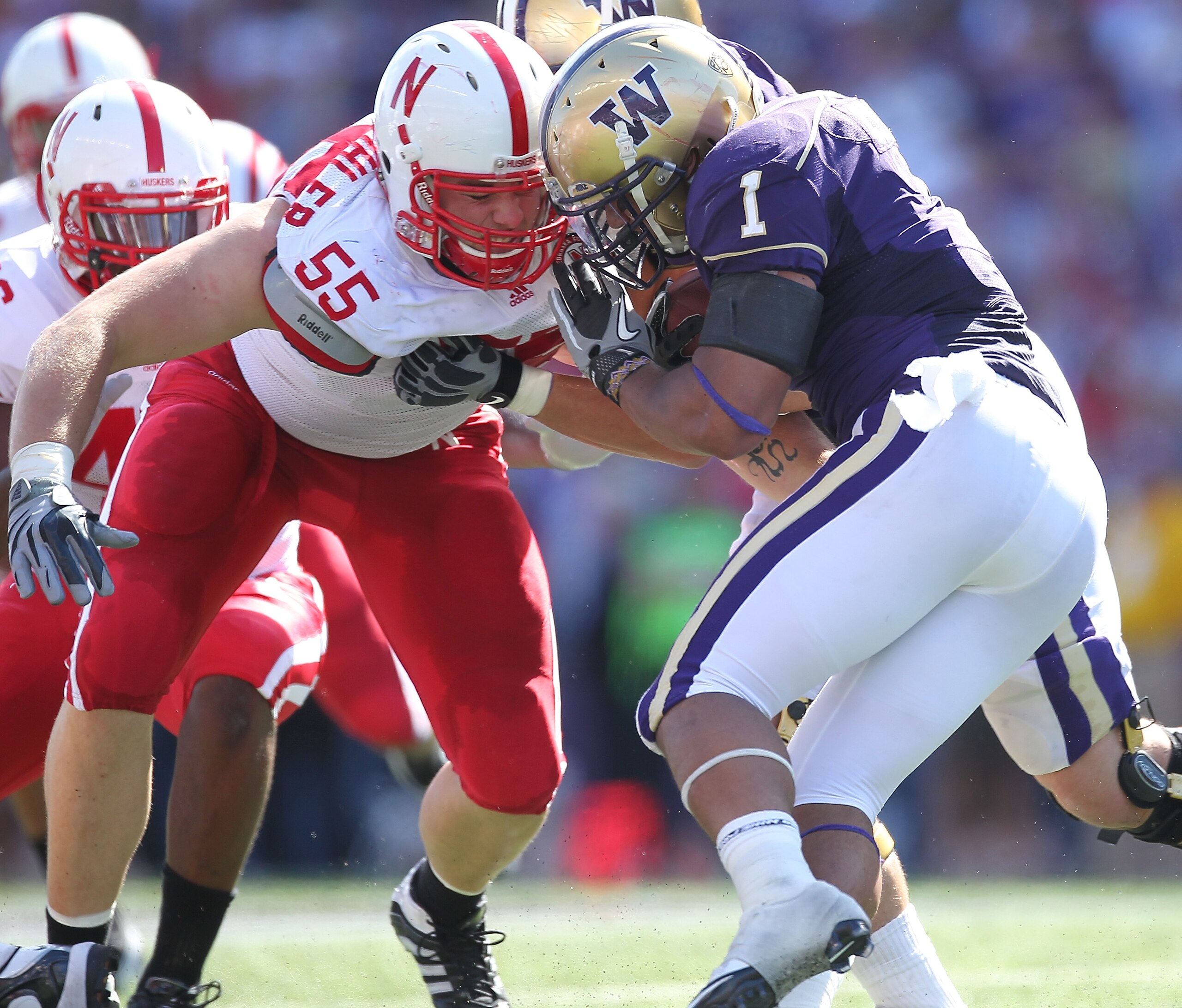 SEATTLE - SEPTEMBER 18: Running back Chris Polk #1 of the Washington Huskies rushes against Baker Steinkuhler #55 of the Nebraska Cornhuskers on September 18, 2010 at Husky Stadium in Seattle, Washington. The Cornhuskers defeated the Huskies 56-21. (Phot SEATTLE - SEPTEMBER 18: Running back Chris Polk #1 of the Washington Huskies rushes against Baker Steinkuhler #55 of the Nebraska Cornhuskers on September 18, 2010 at Husky Stadium in Seattle, Washington. The Cornhuskers defeated the Huskies 56-21. (Phot