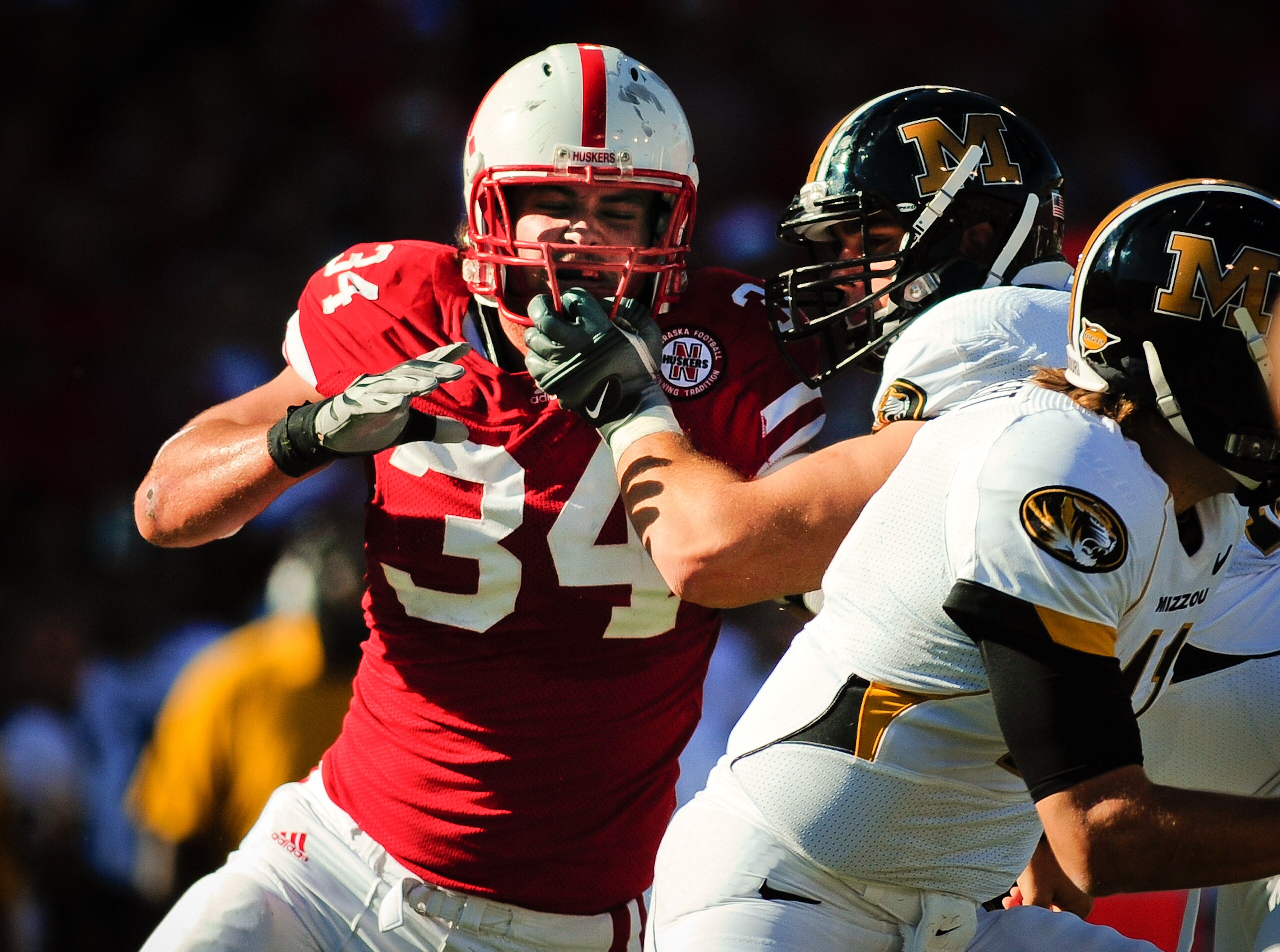 LINCOLN, NE - OCTOBER 30: Defensive end Cameron Meredith #34 of the Nebraska Cornhuskers tries to beat offensive linesman Elvis Fisher #72 of the Missouri Tigers during first half action of their game at Memorial Stadium on October 30, 2010 in Lincoln, N LINCOLN, NE - OCTOBER 30: Defensive end Cameron Meredith #34 of the Nebraska Cornhuskers tries to beat offensive linesman Elvis Fisher #72 of the Missouri Tigers during first half action of their game at Memorial Stadium on October 30, 2010 in Lincoln, N