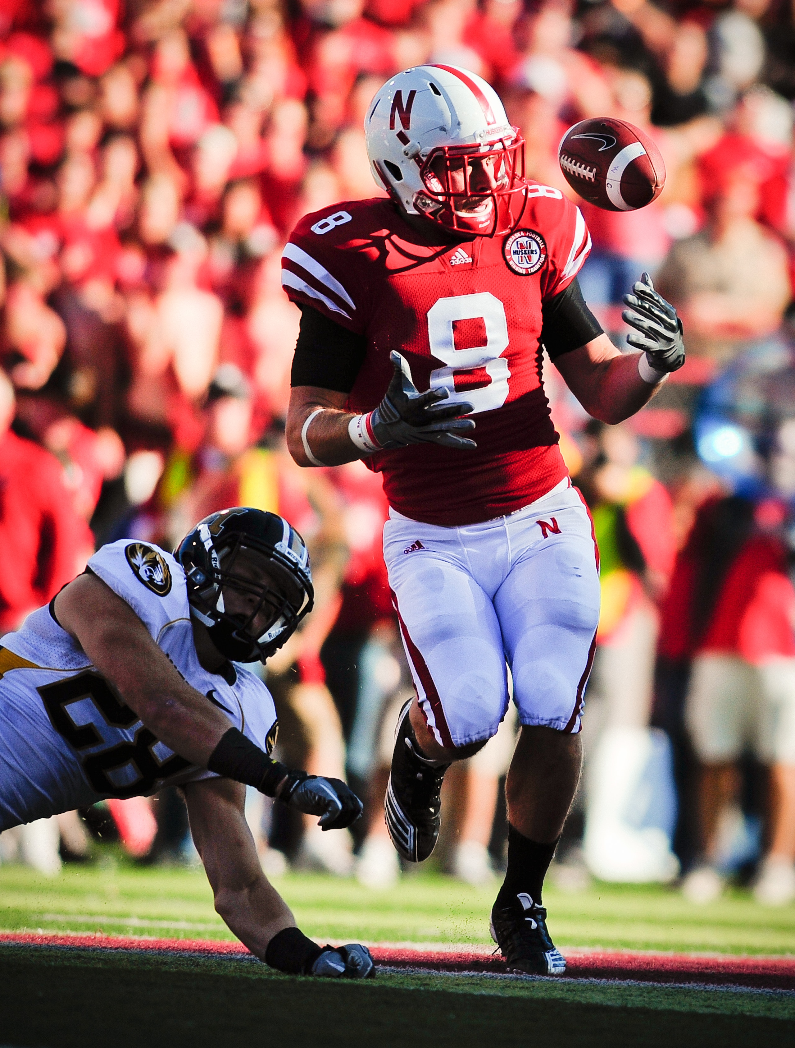 LINCOLN, NE - OCTOBER 30: Safety Austin Cassidy #8 of the Nebraska Cornhuskers eyes a tipped pass intended for Wide receiver T.J. Moe #28 of the Missouri Tigerswuring second half action of their game at Memorial Stadium on October 30, 2010 in Lincoln, Neb LINCOLN, NE - OCTOBER 30: Safety Austin Cassidy #8 of the Nebraska Cornhuskers eyes a tipped pass intended for Wide receiver T.J. Moe #28 of the Missouri Tigerswuring second half action of their game at Memorial Stadium on October 30, 2010 in Lincoln, Neb