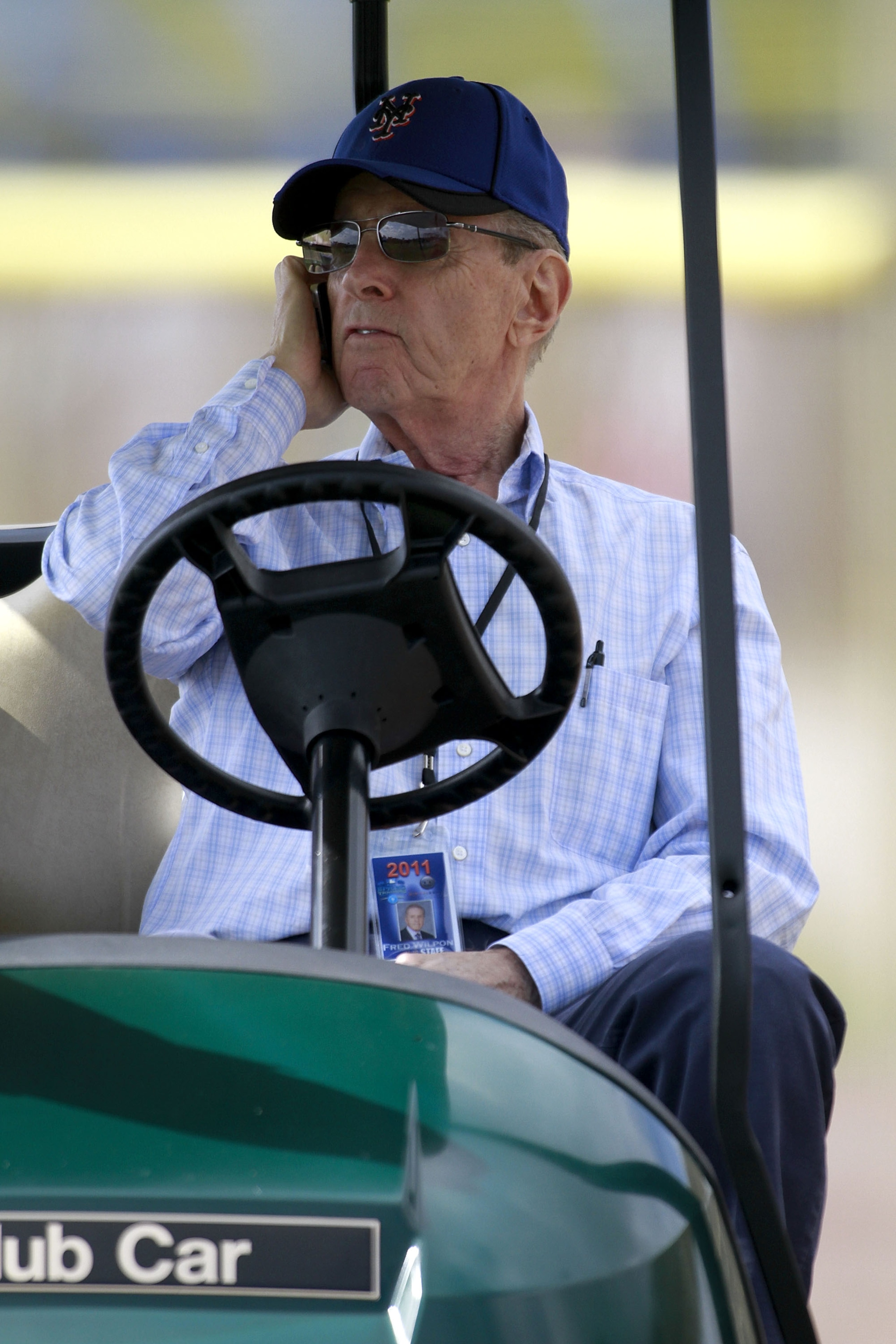 PORT ST. LUCIE, FL - FEBRUARY 17:  Owner Fred Wilpon of the New York Mets talks on the phone during spring training at Tradition Field on February 17, 2011 in Port St. Lucie, Florida.  (Photo by Marc Serota/Getty Images)