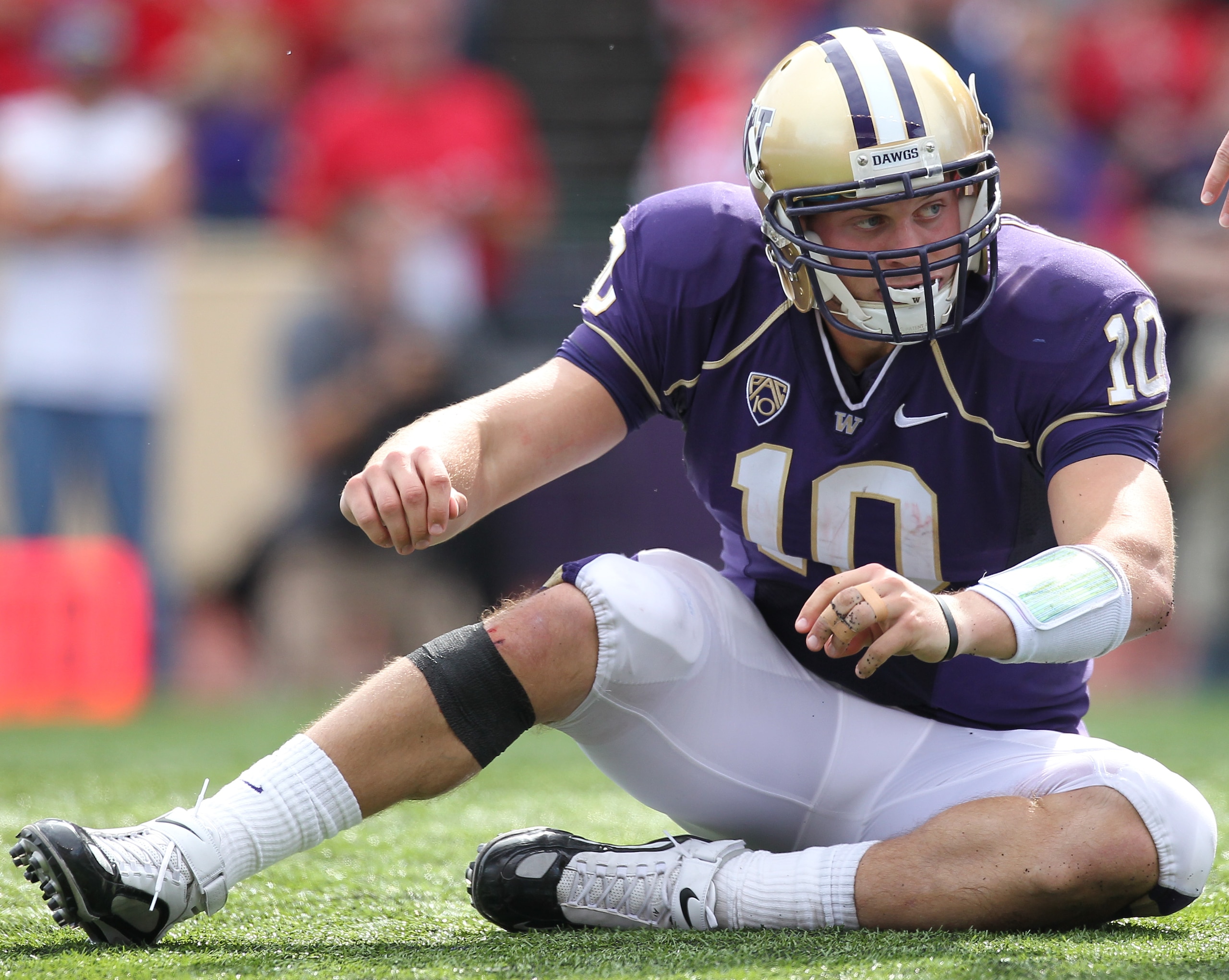 SEATTLE - SEPTEMBER 18: Quarterback Jake Locker #10 of the Washington Huskies gets up after being tackled during the game against the Nebraska Cornhuskers on September 18, 2010 at Husky Stadium in Seattle, Washington. (Photo by Otto Greule Jr/Getty Images