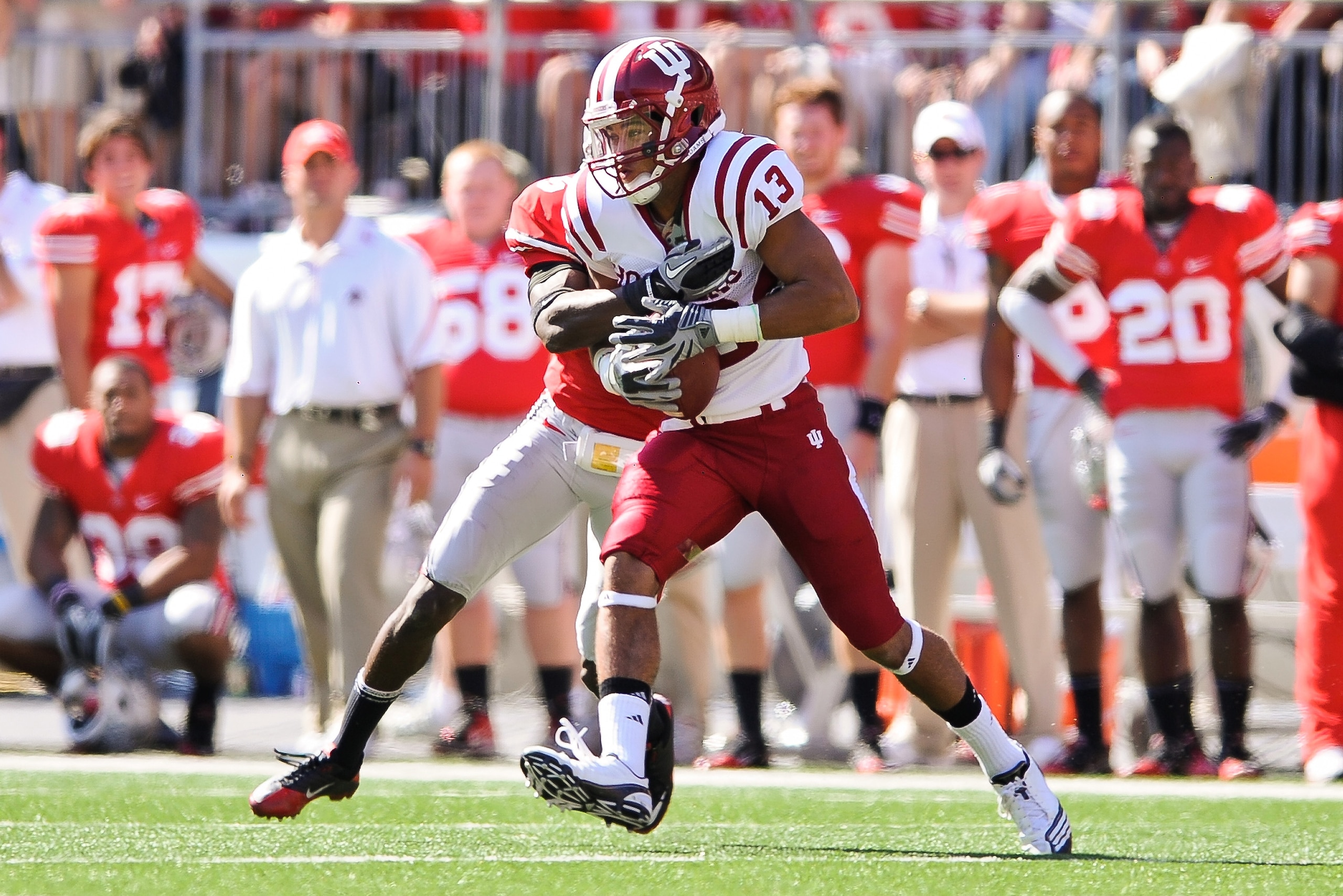 COLUMBUS, OH - OCTOBER 9:  Kofi Hughes #13 of the Indiana Hoosiers runs with the ball after making a catch against the Ohio State Buckeyes at Ohio Stadium on October 9, 2010 in Columbus, Ohio.  (Photo by Jamie Sabau/Getty Images)