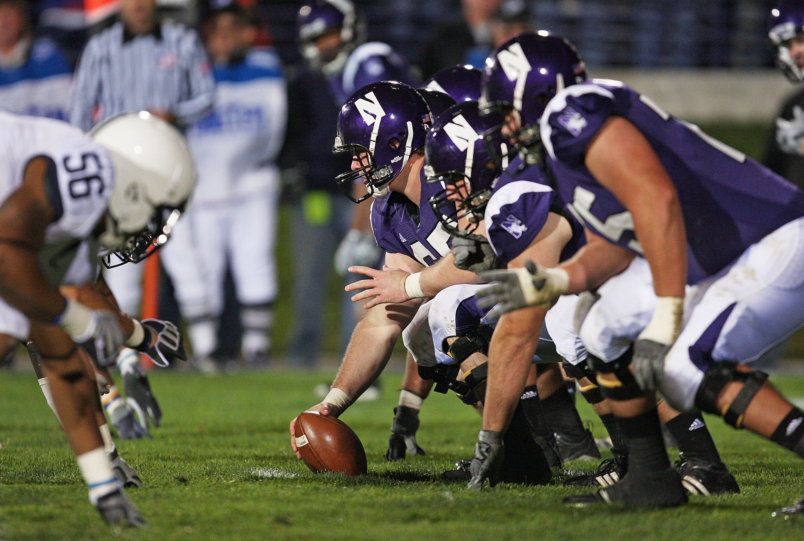 EVANSTON, IL - OCTOBER 31: Ben Burkett #65 of the Northwestern Wildcats prepares to snap the ball against the Penn State Nittany Lions at Ryan Field on October 31, 2009 in Evanston, Illinois. Penn State defeated Northwestern 34-13. (Photo by Jonathan Dani