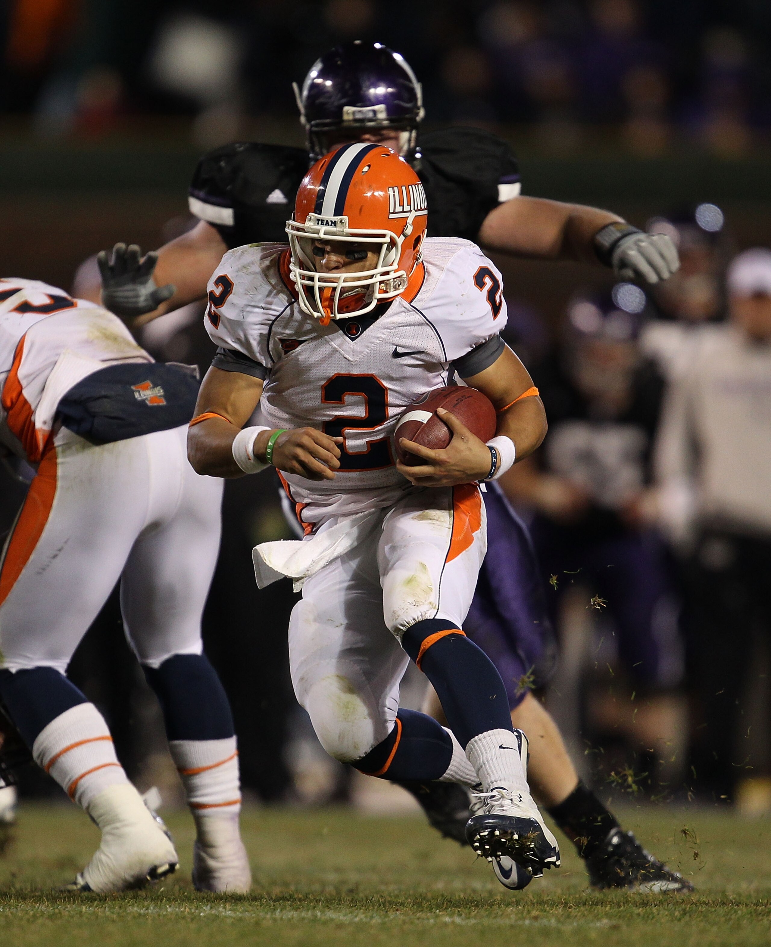 CHICAGO - NOVEMBER 20: Nathan Scheelhasse #2 of the Illinois Fighting Illini runs against the Northwestern Wildcats during a game played at Wrigley Field on November 20, 2010 in Chicago, Illinois. Illinois defeated Northwestern 48-27. (Photo by Jonathan D