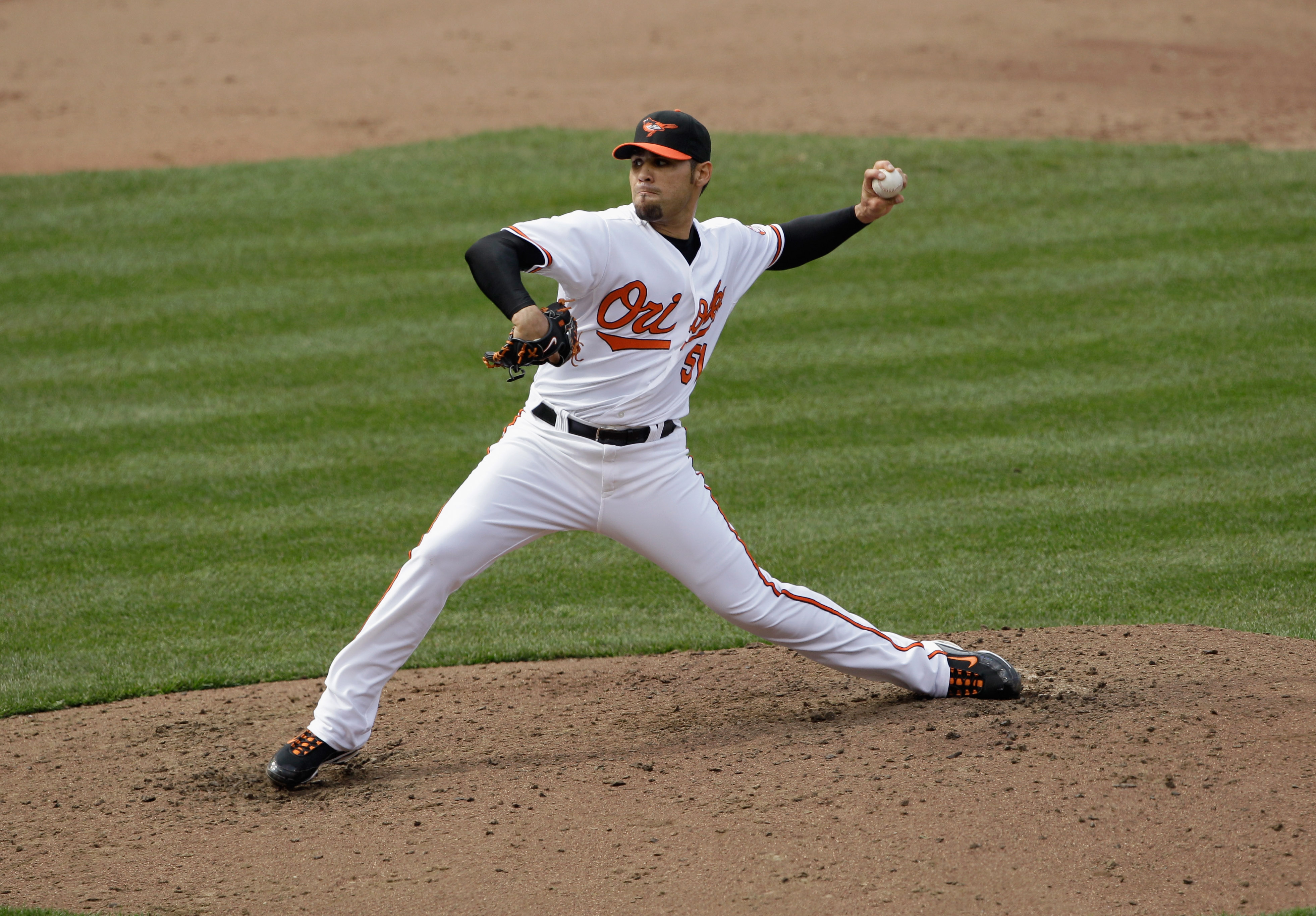 BALTIMORE, MD - APRIL 10:  Pitcher Mike Gonzalez #51 of the Baltimore Orioles delivers to a Texas Rangers batter at Oriole Park at Camden Yards on April 10, 2011 in Baltimore, Maryland.  (Photo by Rob Carr/Getty Images)