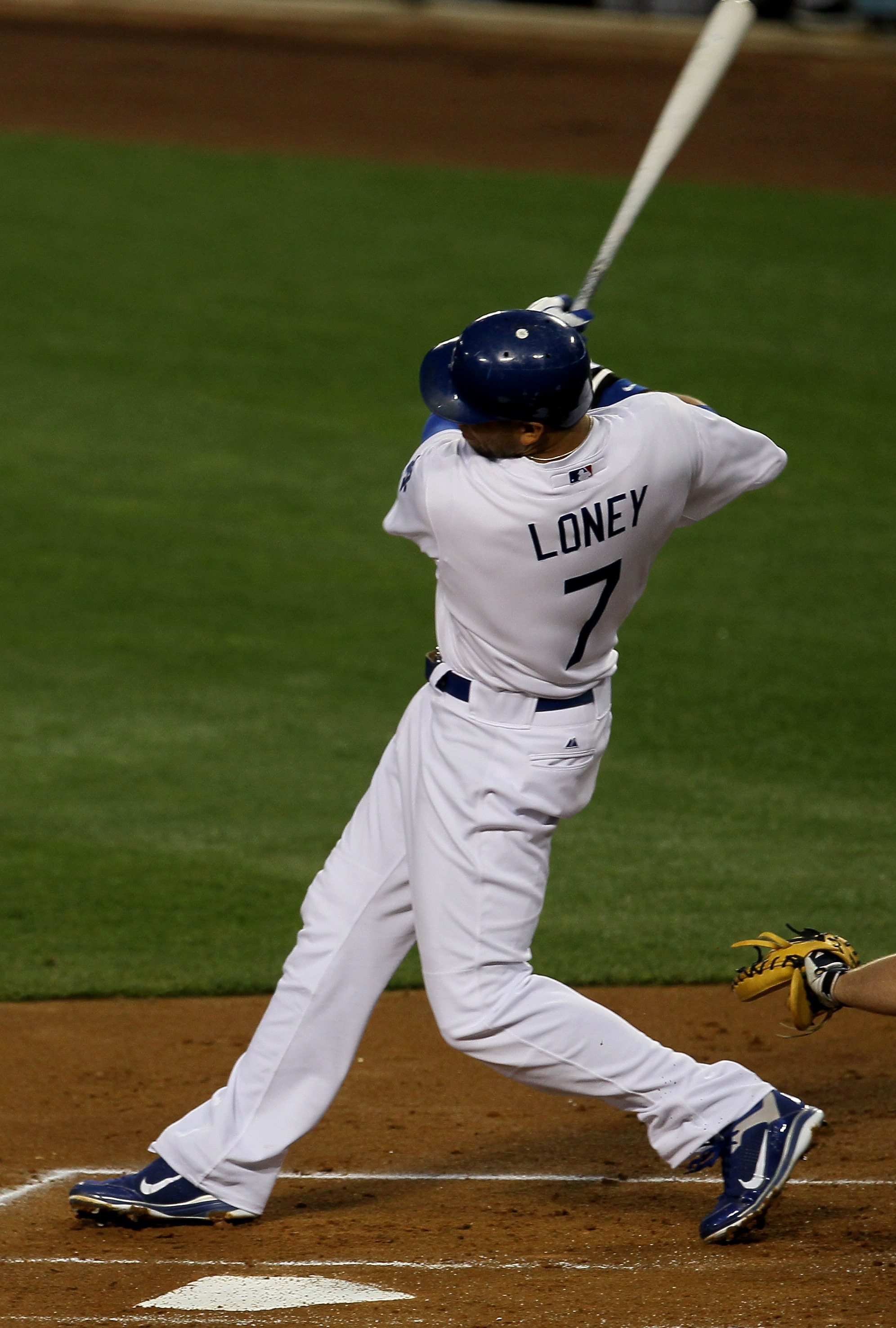 LOS ANGELES - APRIL 18:  James Loney #7 of the Los Angeles Dodgers hits a two RBI single in the first inning against the Atlanta Braves on April 18, 2011 at Dodger Stadium in Los Angeles, California.   (Photo by Stephen Dunn/Getty Images)