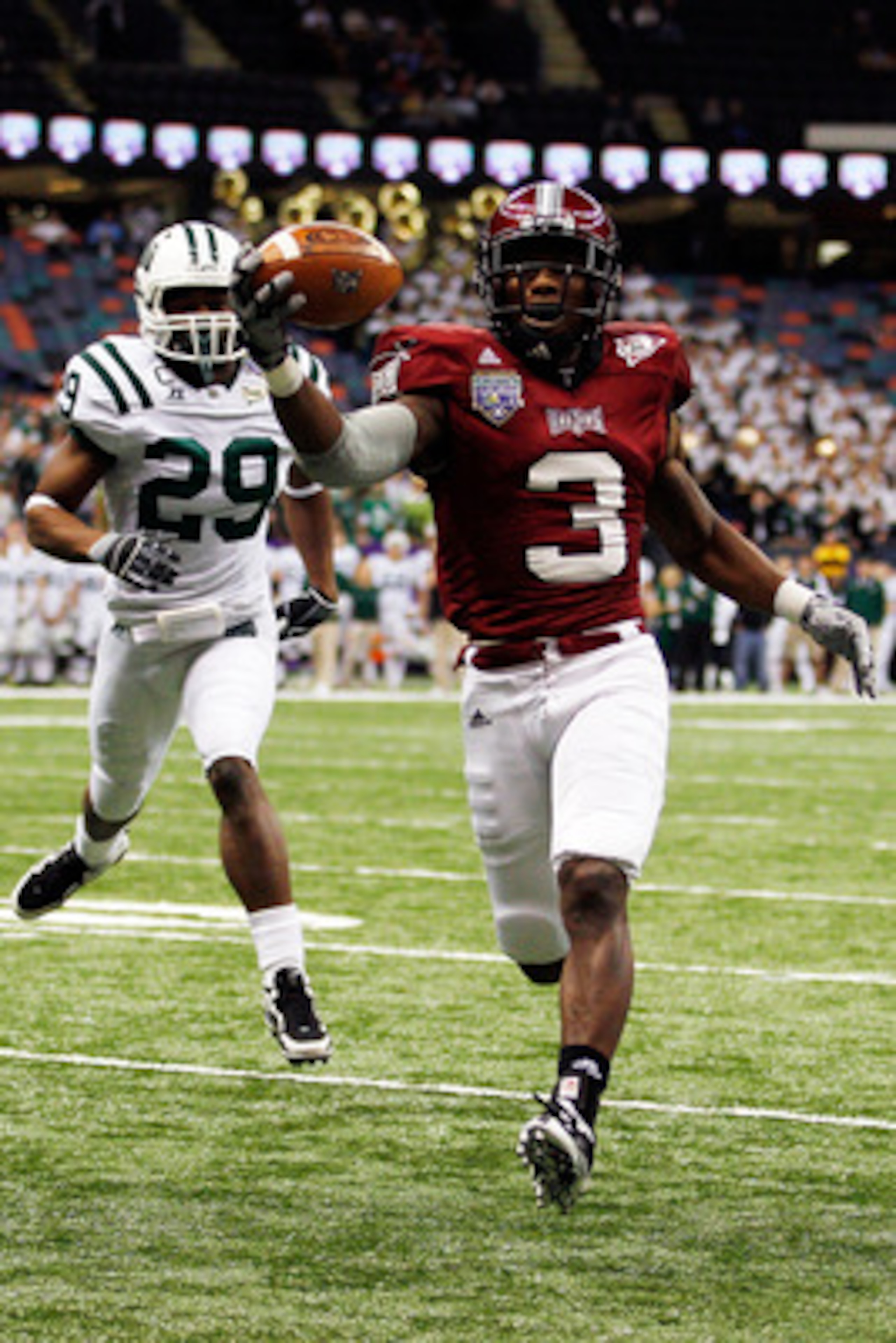 NEW ORLEANS, LA - DECEMBER 18: Jerrel Jernigan #3 of the Troy University Trojans scores a touchdown over Donovan Fletcher #29 of the Ohio University Bobcats during the R&L Carriers New Orleans Bowl at the Louisiana Superdome on December 18, 2010 in New O NEW ORLEANS, LA - DECEMBER 18: Jerrel Jernigan #3 of the Troy University Trojans scores a touchdown over Donovan Fletcher #29 of the Ohio University Bobcats during the R&L Carriers New Orleans Bowl at the Louisiana Superdome on December 18, 2010 in New O