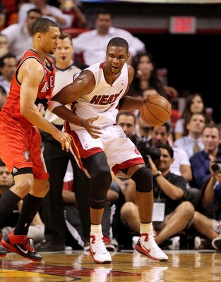 MIAMI, FL - MARCH 08: Chris Bosh #1 of the Miami Heat posts up Brandon Roy #7 of the Portland Trail Blazers during a game at American Airlines Arena on March 8, 2011 in Miami, Florida. NOTE TO USER: User expressly acknowledges and agrees that, by download