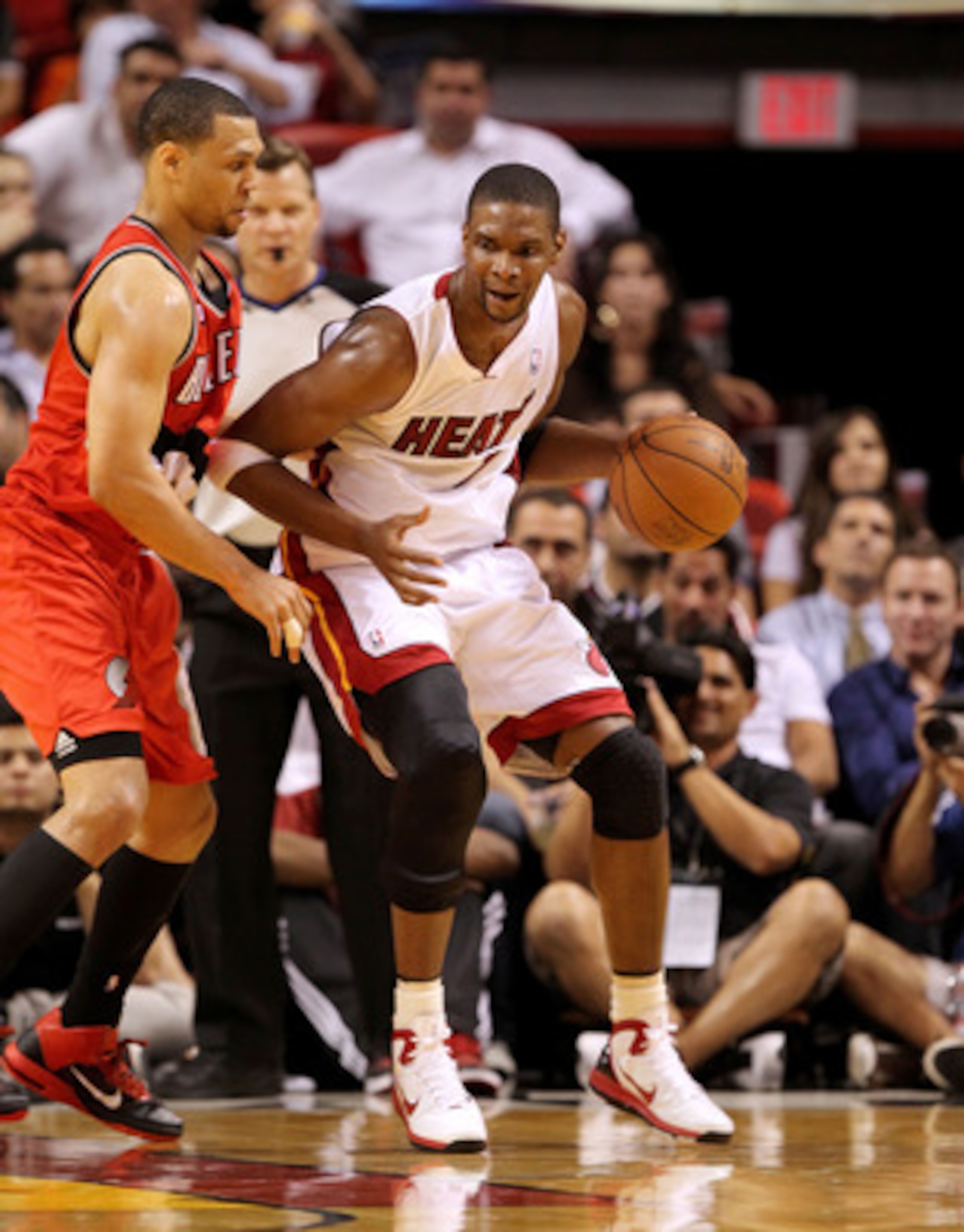 MIAMI, FL - MARCH 08: Chris Bosh #1 of the Miami Heat posts up Brandon Roy #7 of the Portland Trail Blazers during a game at American Airlines Arena on March 8, 2011 in Miami, Florida. NOTE TO USER: User expressly acknowledges and agrees that, by download