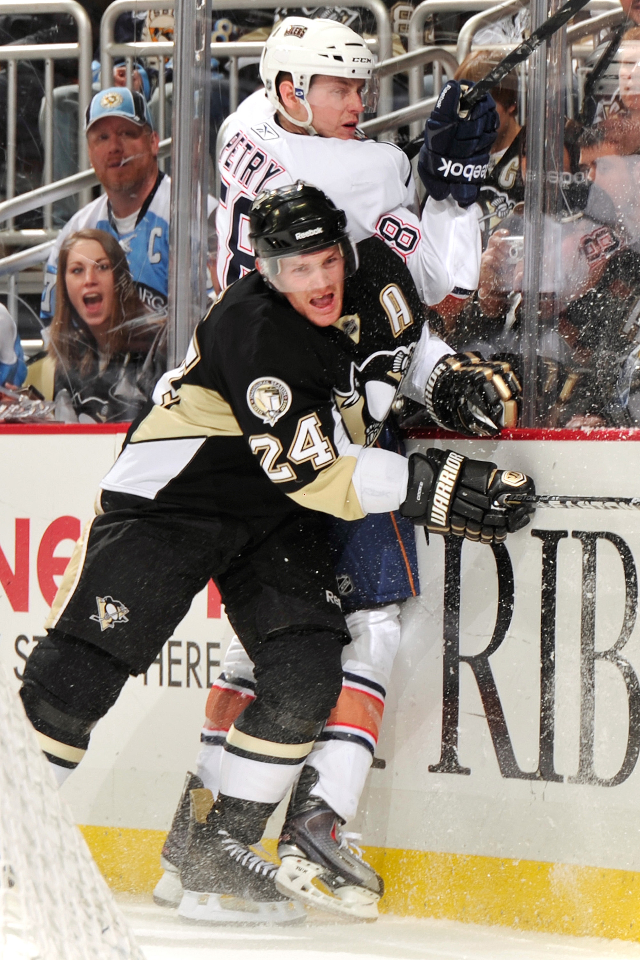 PITTSBURGH, PA - MARCH 13: Matt Cooke #24 of the Pittsburgh Penguins finishes his check on Jeff Petry #58 of the Edmonton Oilers on March 13, 2011 at CONSOL Energy Center in Pittsburgh, Pennsylvania. (Photo by Jamie Sabau/Getty Images) PITTSBURGH, PA - MARCH 13: Matt Cooke #24 of the Pittsburgh Penguins finishes his check on Jeff Petry #58 of the Edmonton Oilers on March 13, 2011 at CONSOL Energy Center in Pittsburgh, Pennsylvania. (Photo by Jamie Sabau/Getty Images)