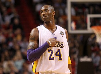 MIAMI, FL - MARCH 10: Kobe Bryant #24 of the Los Angeles Lakers calls a play during a game against the Miami Heat at American Airlines Arena on March 10, 2011 in Miami, Florida. NOTE TO USER: User expressly acknowledges and agrees that, by downloading and