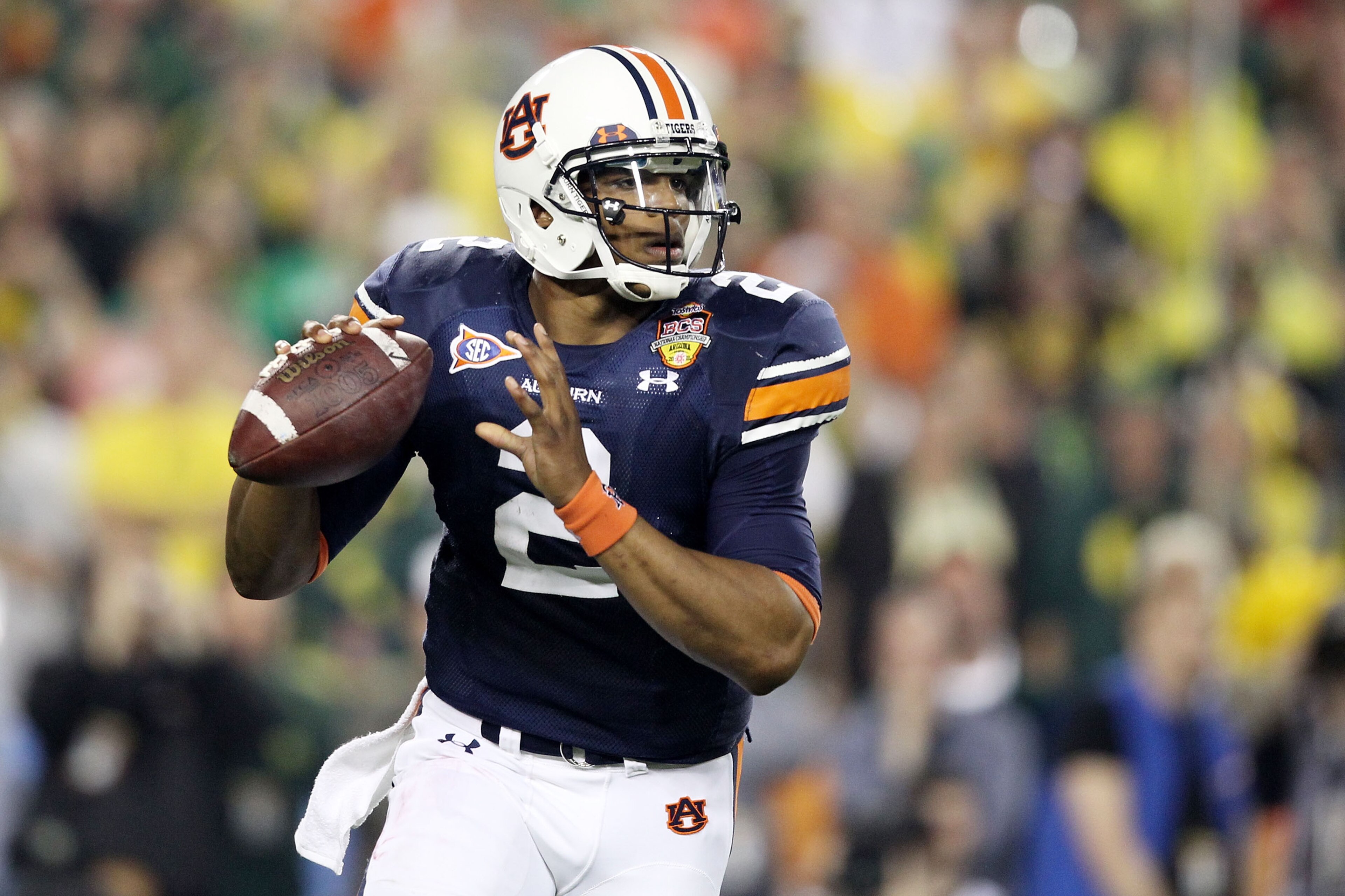 GLENDALE, AZ - JANUARY 10: Cameron Newton #2 of the Auburn Tigers scrambles against the Oregon Ducks during the Tostitos BCS National Championship Game at University of Phoenix Stadium on January 10, 2011 in Glendale, Arizona. (Photo by Christian Peters GLENDALE, AZ - JANUARY 10: Cameron Newton #2 of the Auburn Tigers scrambles against the Oregon Ducks during the Tostitos BCS National Championship Game at University of Phoenix Stadium on January 10, 2011 in Glendale, Arizona. (Photo by Christian Peters