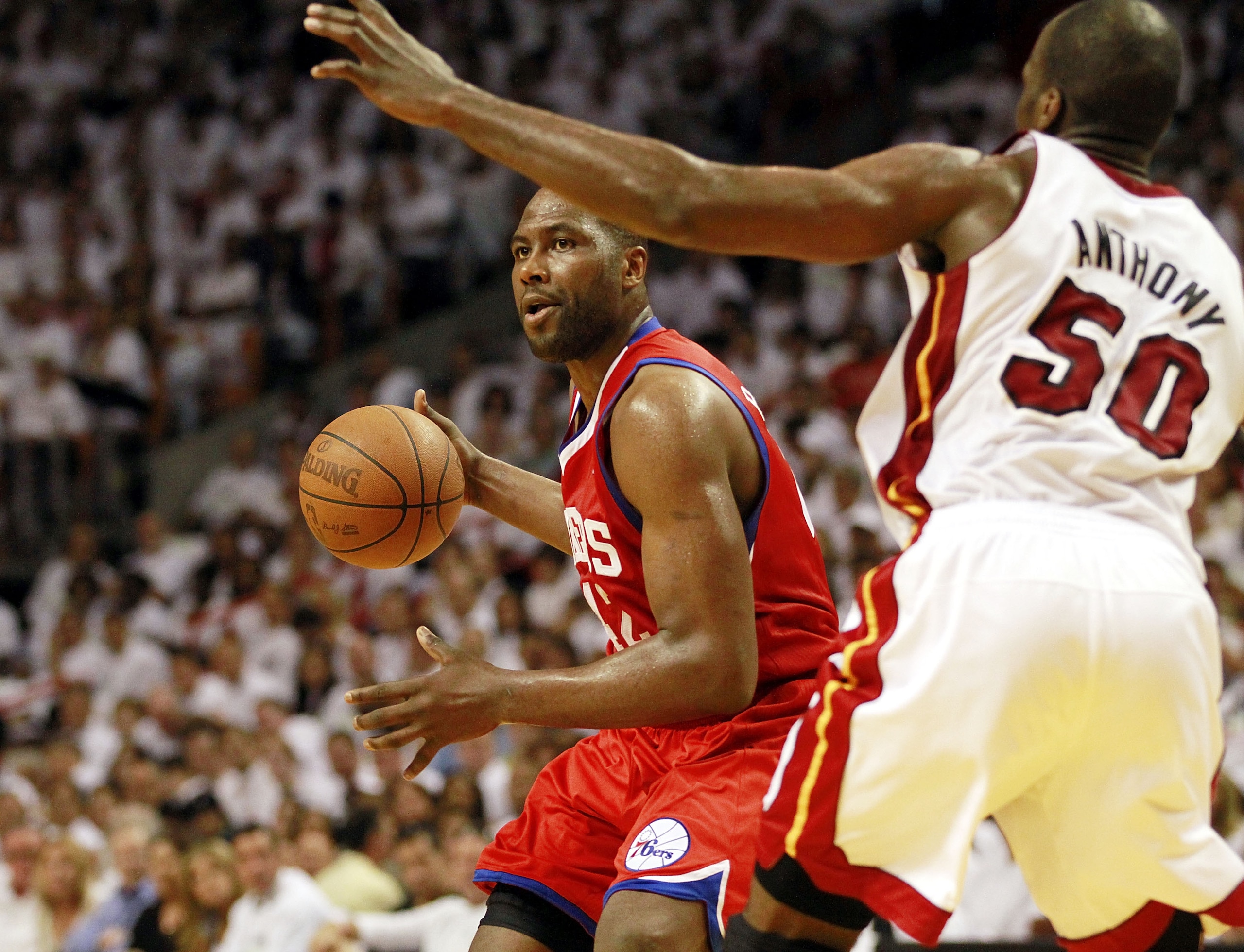 MIAMI, FL - APRIL 16:  Forward Joel Anthony #50 of the  Miami Heat defends Forward Elton Brand #42 of the Philadelphia 76ers at the American Airlines Arena in game one of the Eastern Conference Quarterfinals in the 2011 NBA Playoffs on April 16, 2011 in M