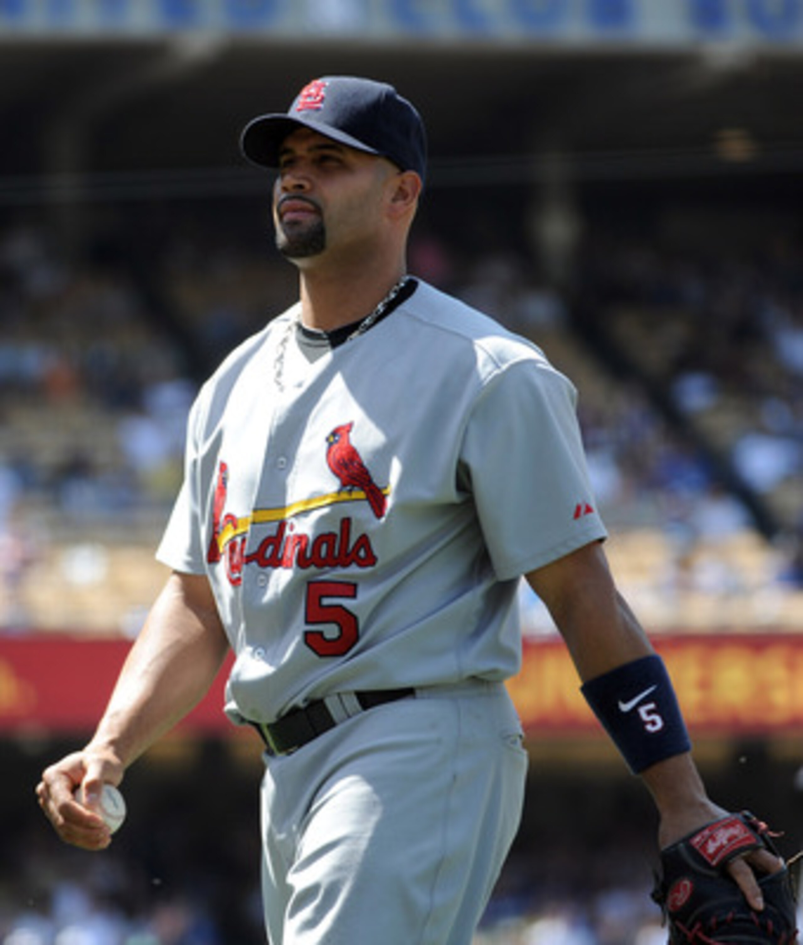 LOS ANGELES, CA - APRIL 17:  Albert Pujols #5 of the St. Louis Cardinals leaves the field against the Los Angeles Dodgers at Dodger Stadium on April 17, 2011 in Los Angeles, California.  (Photo by Harry How/Getty Images)