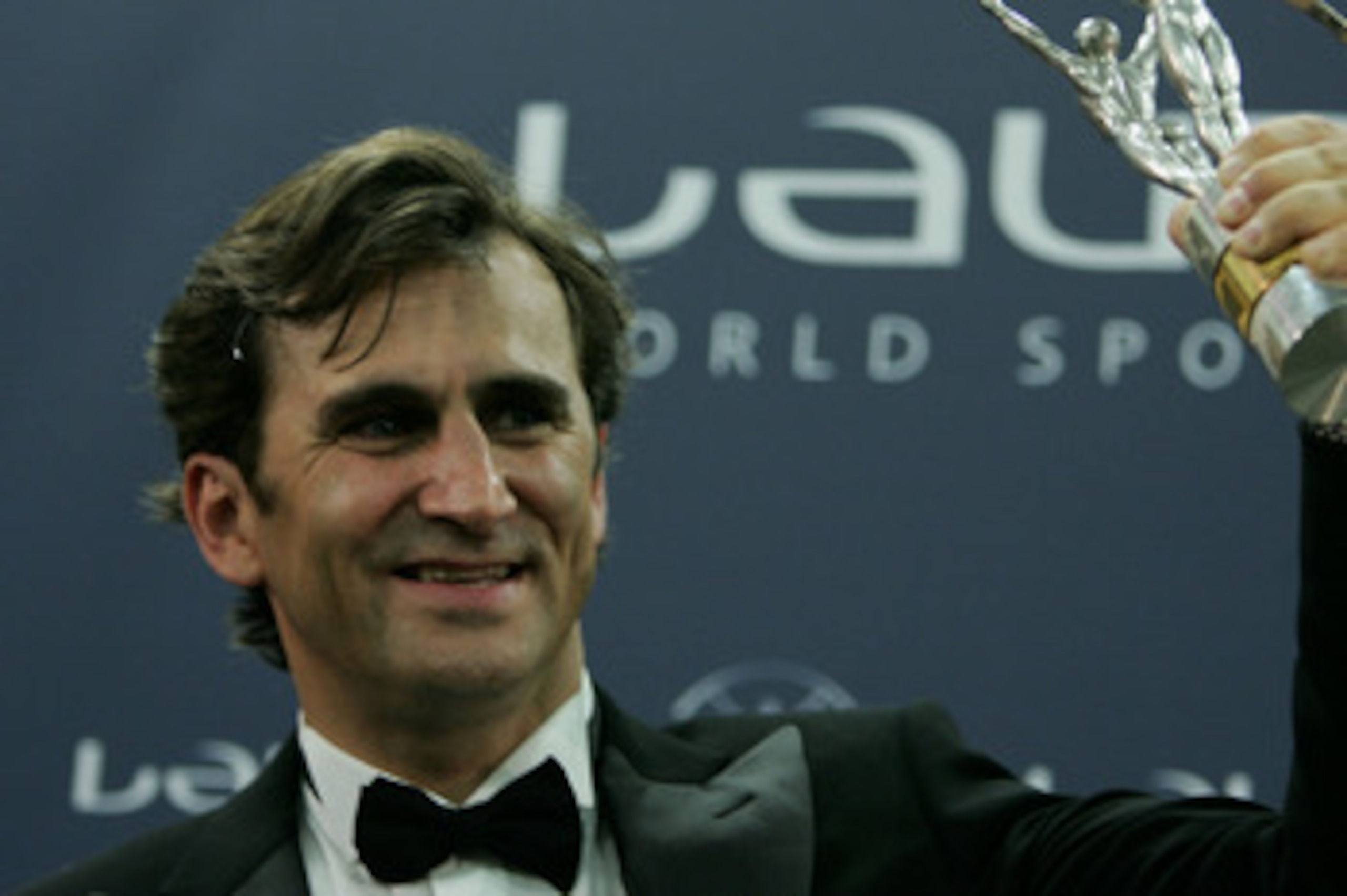 ESTORIL, PORTUGAL - MAY 16:  Motor racing driver Alessandro 'Alex' Zanardi poses for photographers with his Laureus World Comeback of the Year award during the Laureus World Sports Awards on May 16, 2005 at the Estoril Casino, Estoril, Portugal.  (Photo b