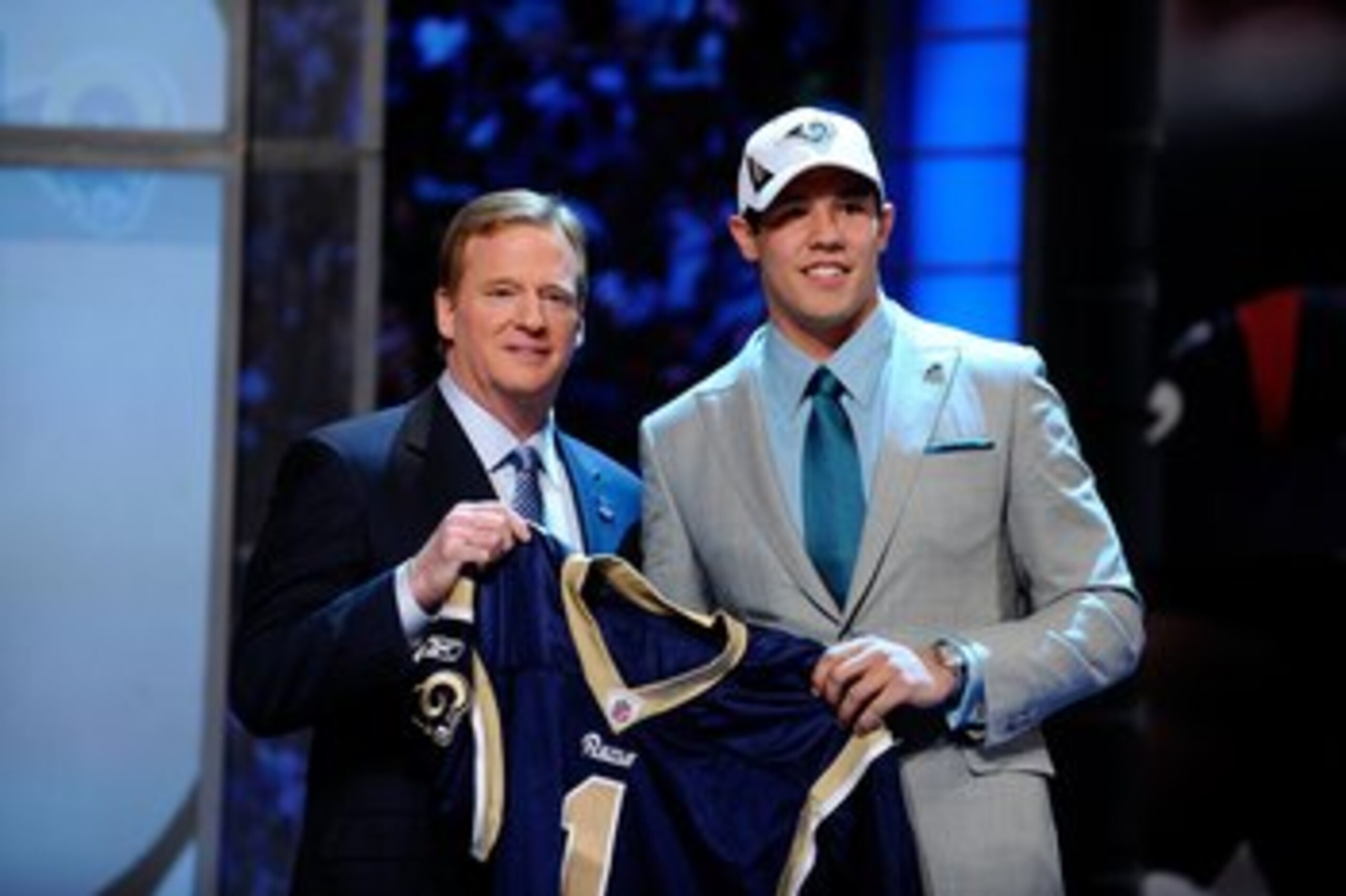 NEW YORK - APRIL 22:  Quarterback Sam Bradford (R) from the Oklahoma Sooners poses with NFL Commissioner Roger Goodell as they hold up a St. Louis Rams jersey after the Rams selected Bradford numer 1 overall during the first round of the 2010 NFL Draft at