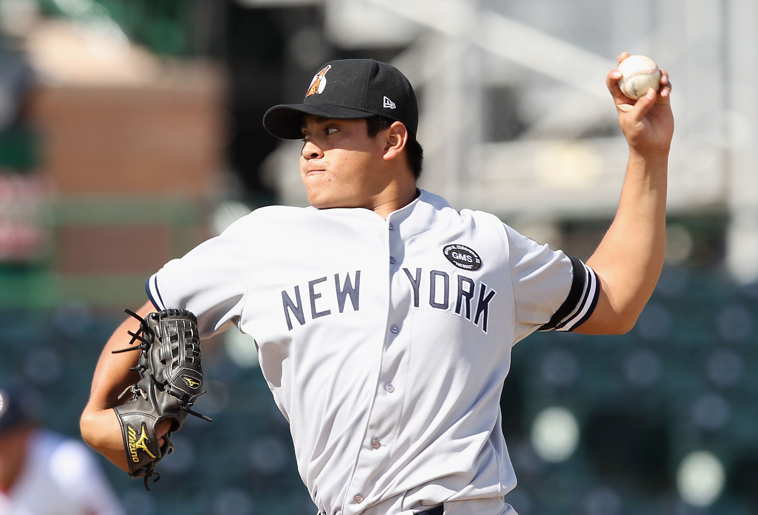 SCOTTSDALE, AZ - OCTOBER 23:  New York Yankees prospect Manuel Banuelos playing for the Phoenix Desert Dogs pitches against the Scottsdale Scorpions during the AZ Fall League game at Scottsdale Stadium on October 23, 2010 in Scottsdale, Arizona.  (Photo b