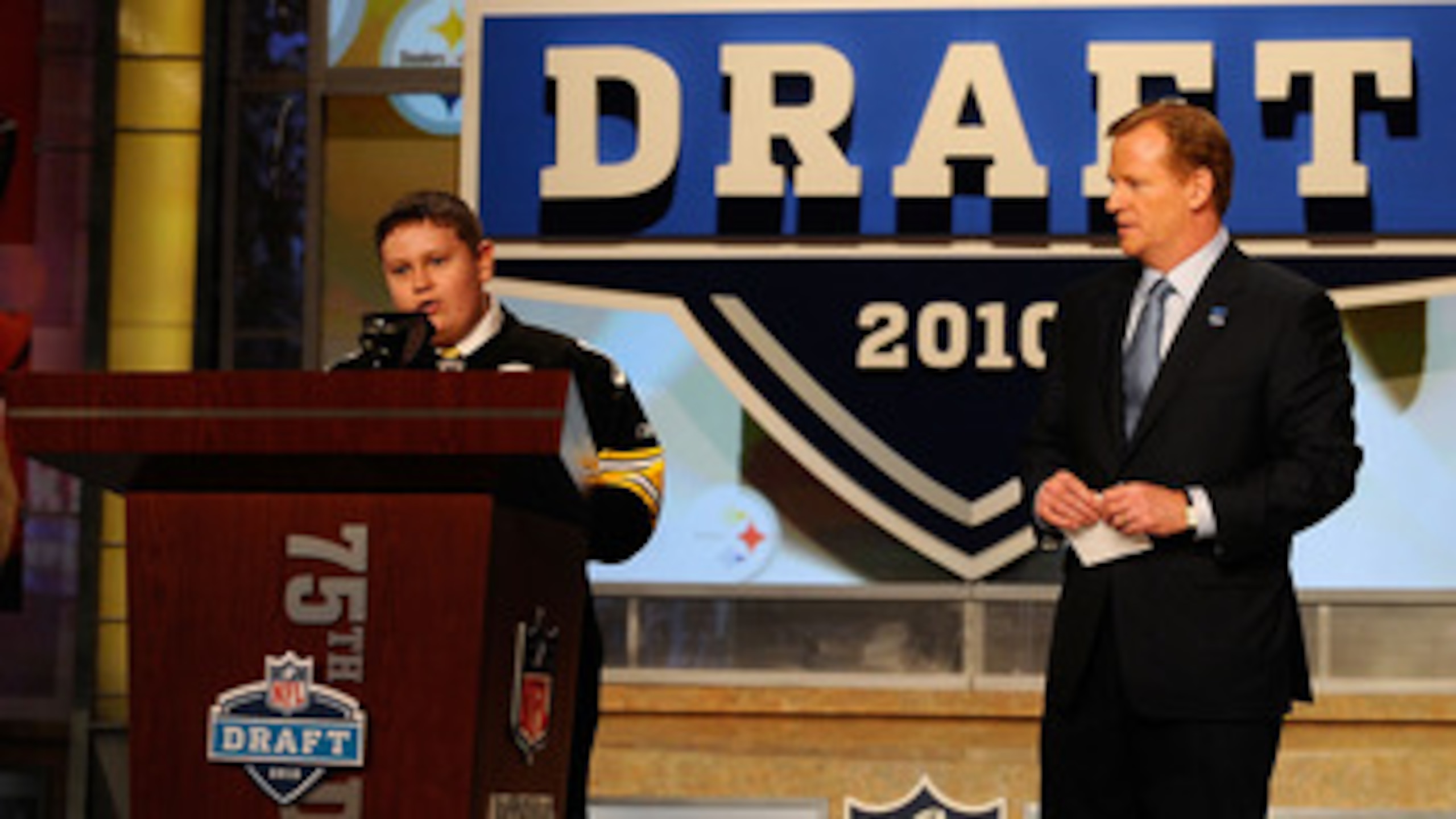 NEW YORK - APRIL 22: NFL Commissioner Roger Goodell looks watches as 16-year old Zachary Hatfield (L) from Florence, KY announces that Maurkice Pouncey from the Florida Gators was selected by the Pittsburgh Steelers number 18 overall during the first rou NEW YORK - APRIL 22: NFL Commissioner Roger Goodell looks watches as 16-year old Zachary Hatfield (L) from Florence, KY announces that Maurkice Pouncey from the Florida Gators was selected by the Pittsburgh Steelers number 18 overall during the first rou