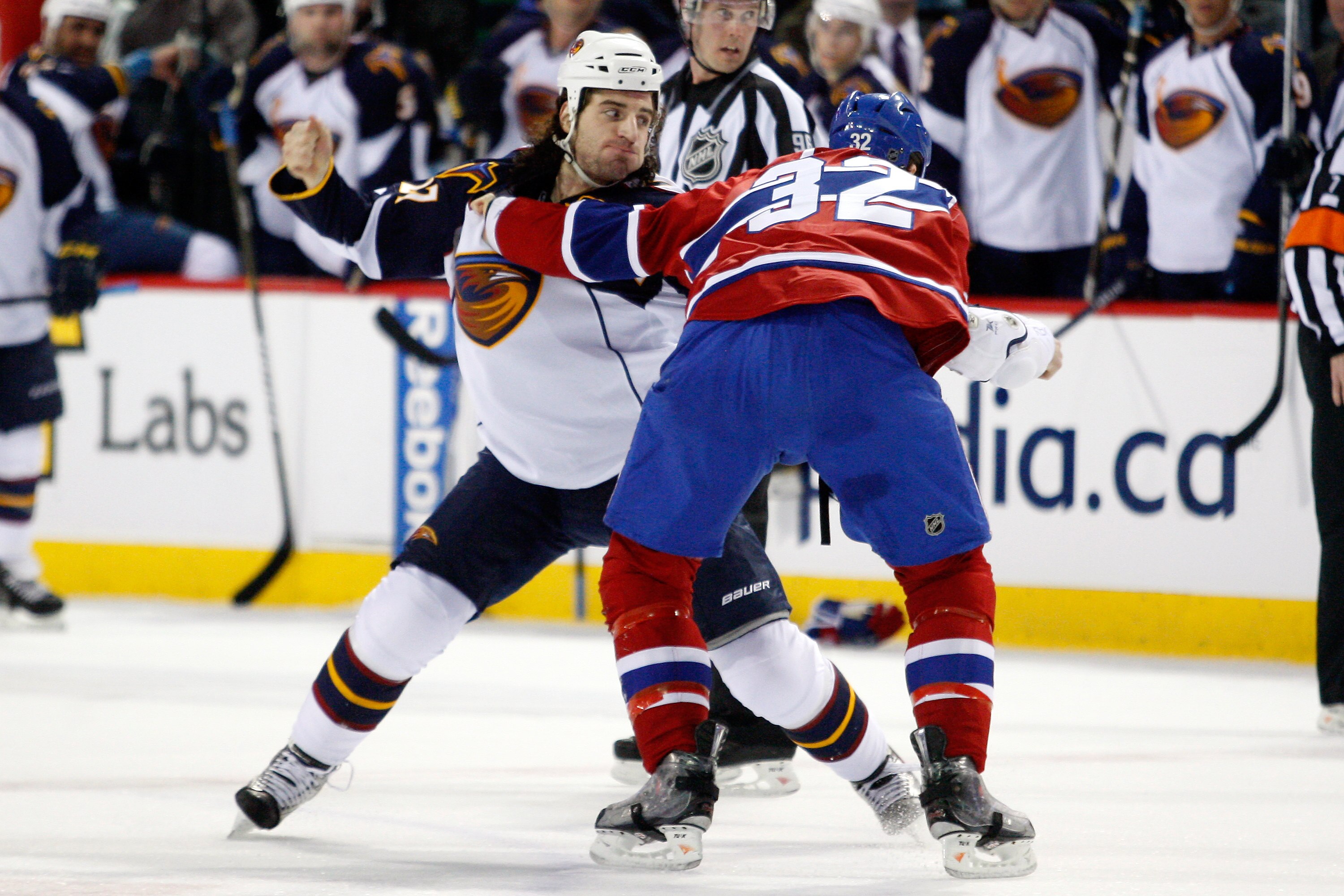 MONTREAL, CANADA - MARCH 29:  Chris Thorburn #27 of the Atlanta Thrashers and Travis Moen #32 of the Montreal Canadiens fight during the NHL game at the Bell Centre on March 29, 2011 in Montreal, Quebec, Canada.  (Photo by Richard Wolowicz/Getty Images)