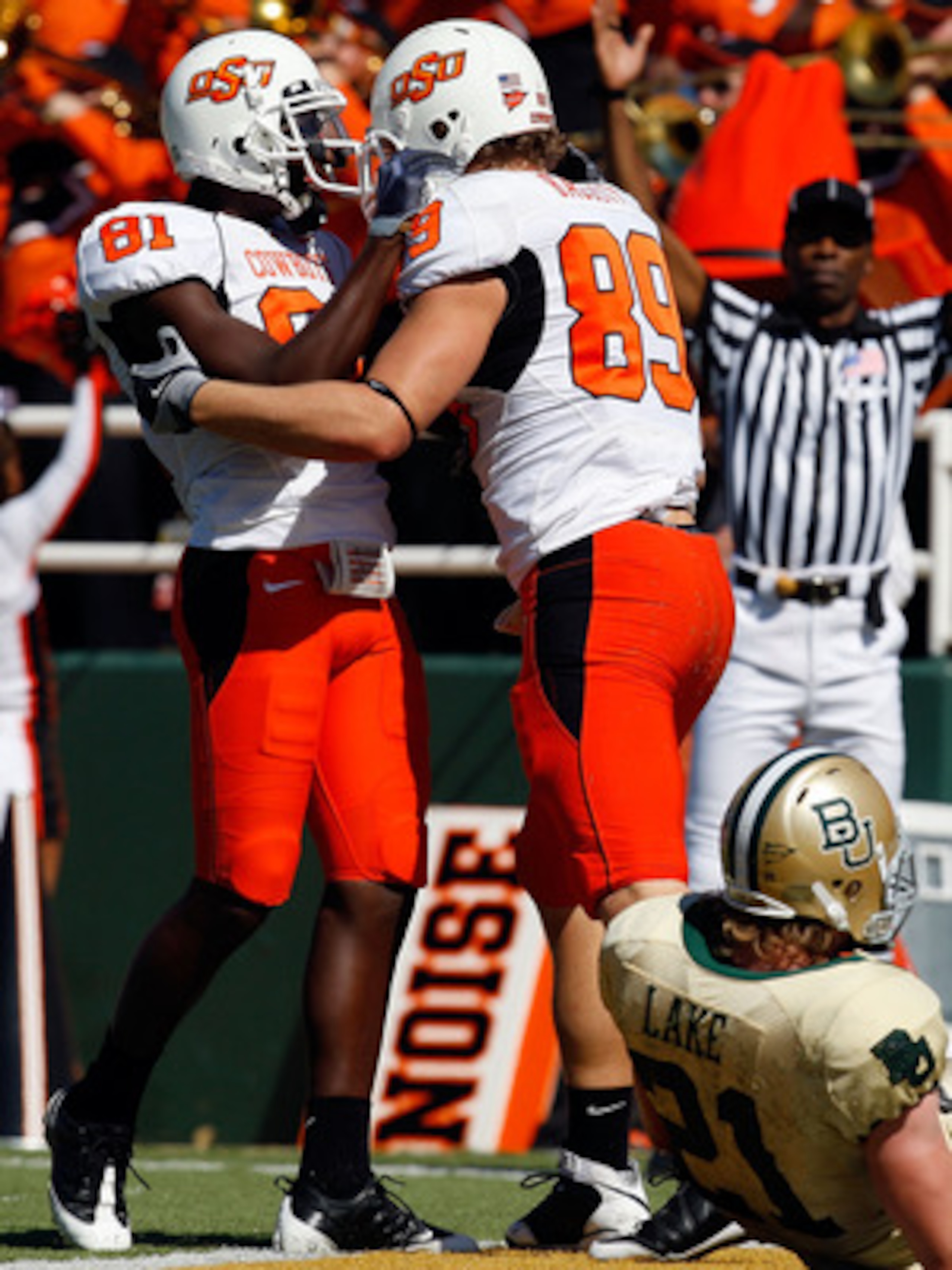 WACO, TX - OCTOBER 24: Justin Blackmon #81 and Cooper Nicholas #89 of the Oklahoma State Cowboys celebrate a touchdown in front of Jordan Lake #21 of the Baylor Bears at Floyd Casey Stadium on October 24, 2009 in Waco, Texas. (Photo by Ronald Martinez/G WACO, TX - OCTOBER 24: Justin Blackmon #81 and Cooper Nicholas #89 of the Oklahoma State Cowboys celebrate a touchdown in front of Jordan Lake #21 of the Baylor Bears at Floyd Casey Stadium on October 24, 2009 in Waco, Texas. (Photo by Ronald Martinez/G