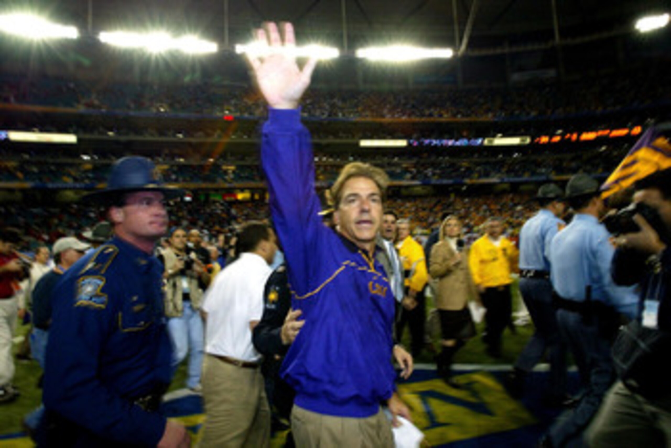 ATLANTA - DECEMBER 6: Head coach Nick Saban of the LSU Tigers waves to the fans after LSU defeated the Georgia Bulldogs 34-13 to win the SEC Championship Game on December 6, 2003 at the Georgia Dome in Atlanta, Georgia. (Photo by Jamie Squire/Getty Imag ATLANTA - DECEMBER 6: Head coach Nick Saban of the LSU Tigers waves to the fans after LSU defeated the Georgia Bulldogs 34-13 to win the SEC Championship Game on December 6, 2003 at the Georgia Dome in Atlanta, Georgia. (Photo by Jamie Squire/Getty Imag